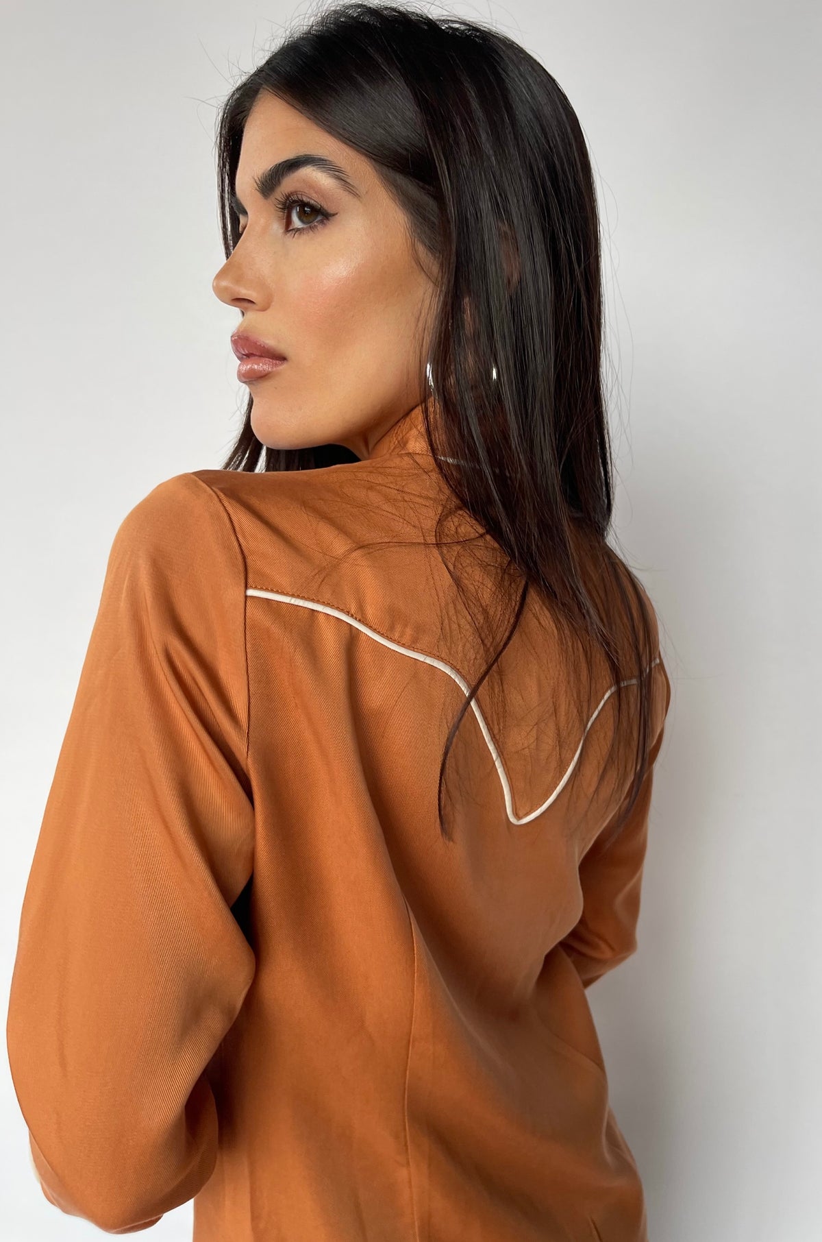 Three-quarter view of the H Bar C San Fernando women's burnt orange Tencel western shirt.