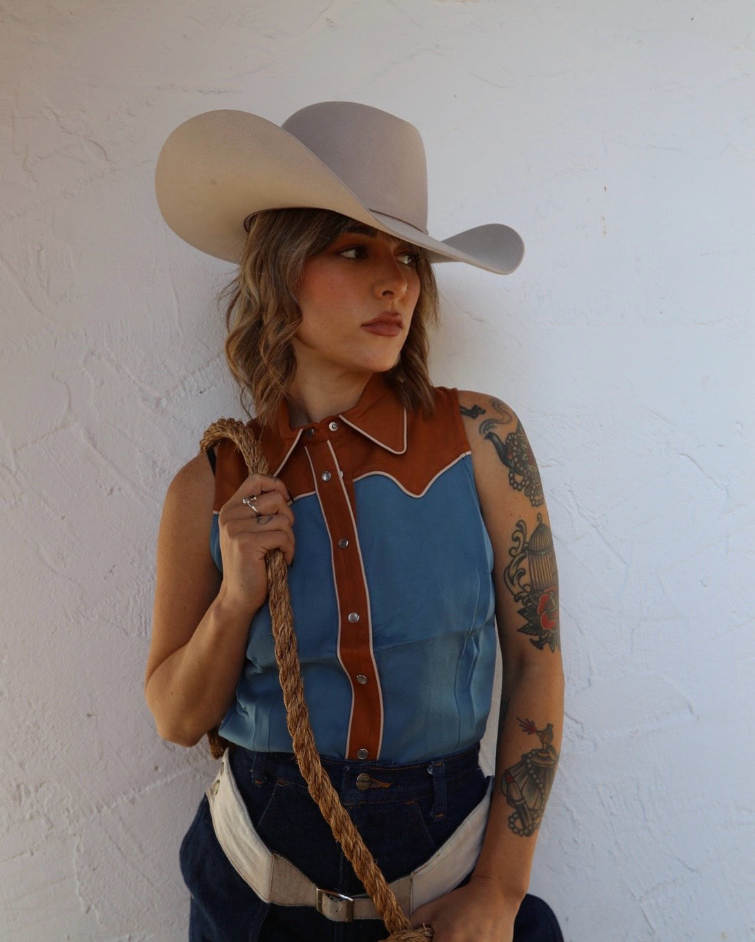 Front view of the H Bar C Atlanta blue sleeveless women's western shirt with caramel yoke.