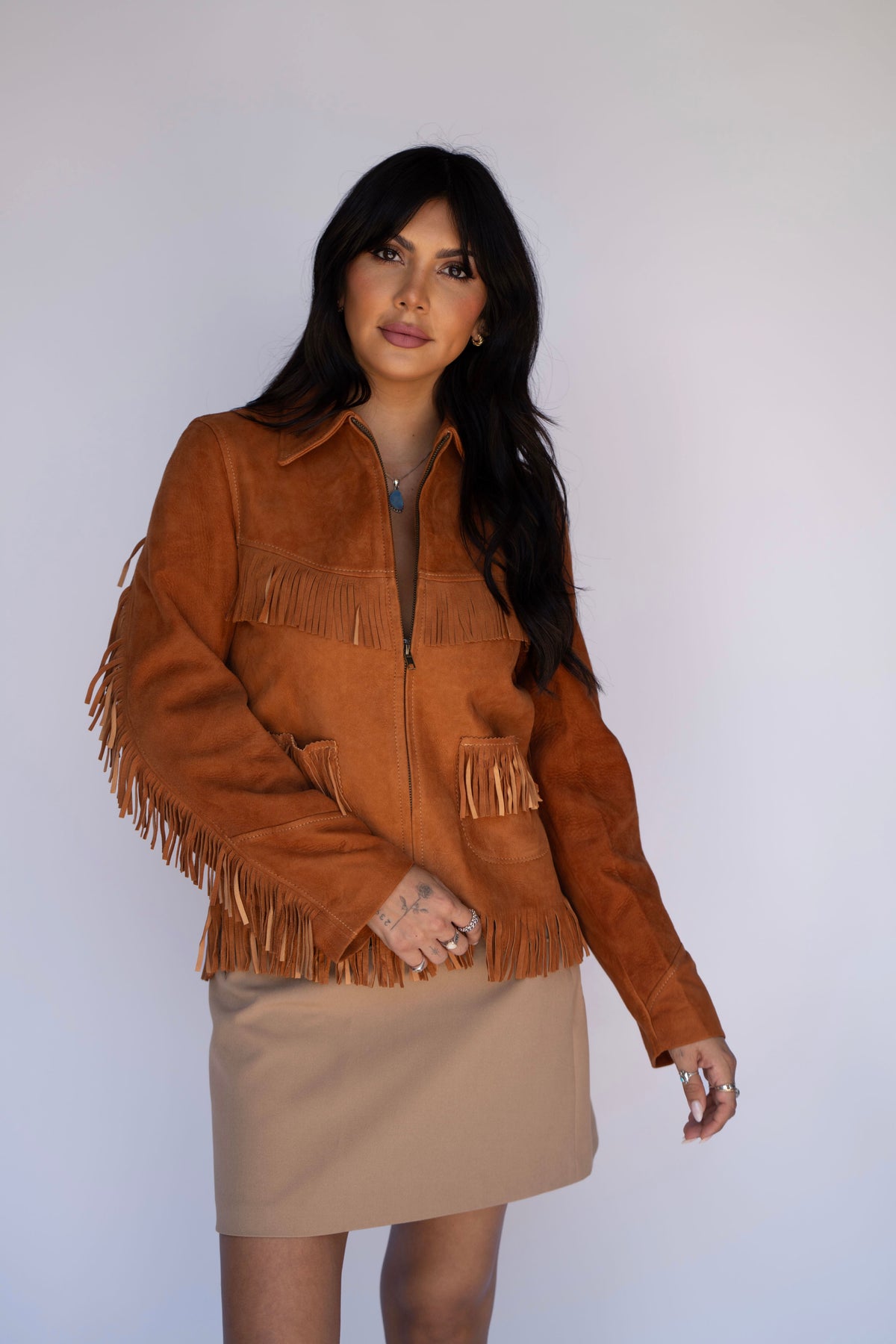 Woman wearing the H Bar C Omaha women's western jacket in brown suede with fringe, rebuilt from a 1950s H Bar C archive pattern.