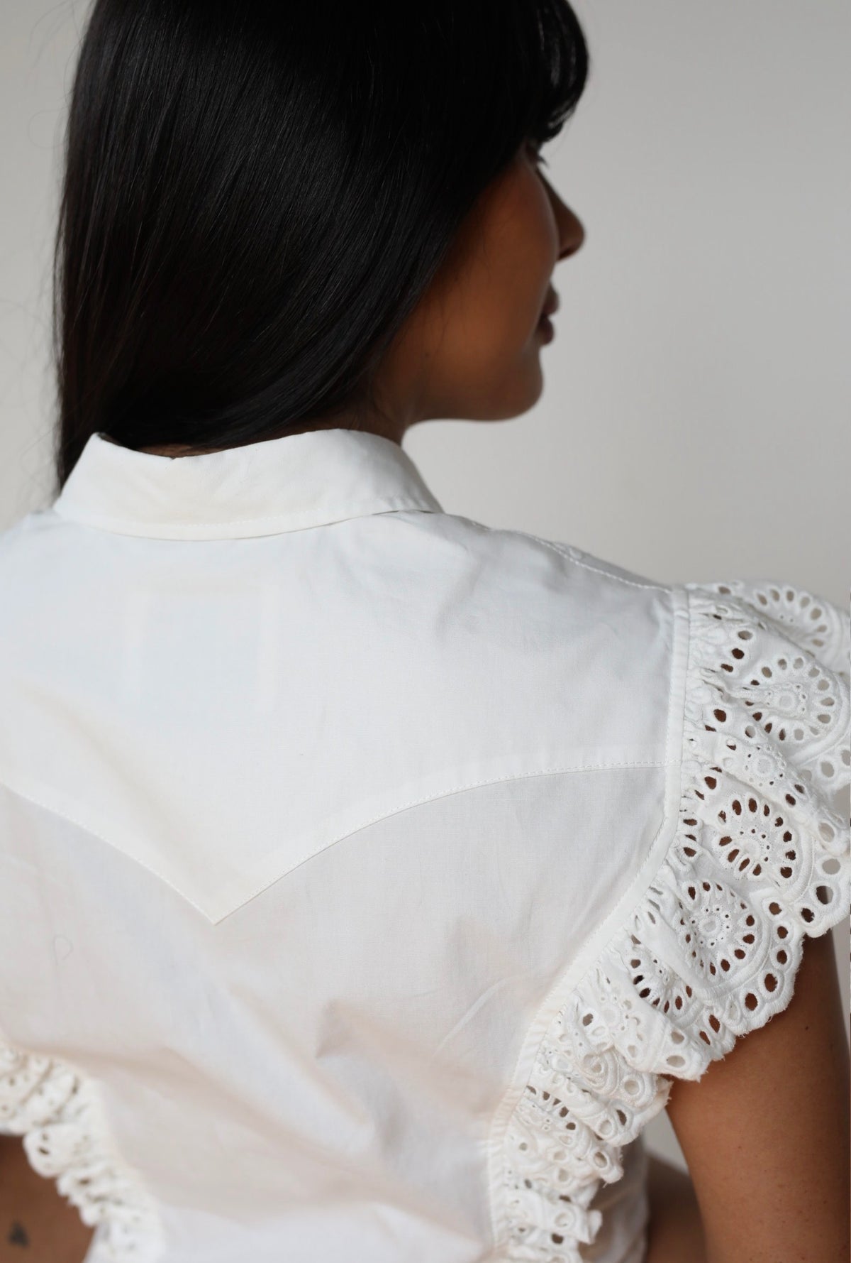 Shoulder detail of The Lexington white western blouse by H Bar C with eyelet lace sleeve.