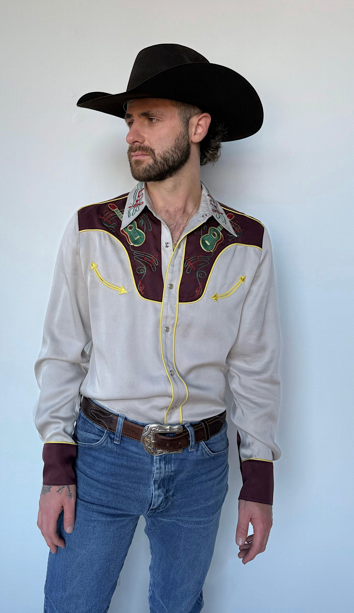Three-quarter view of the H Bar C Cowboy Bob shirt with maroon yokes and cuffs.