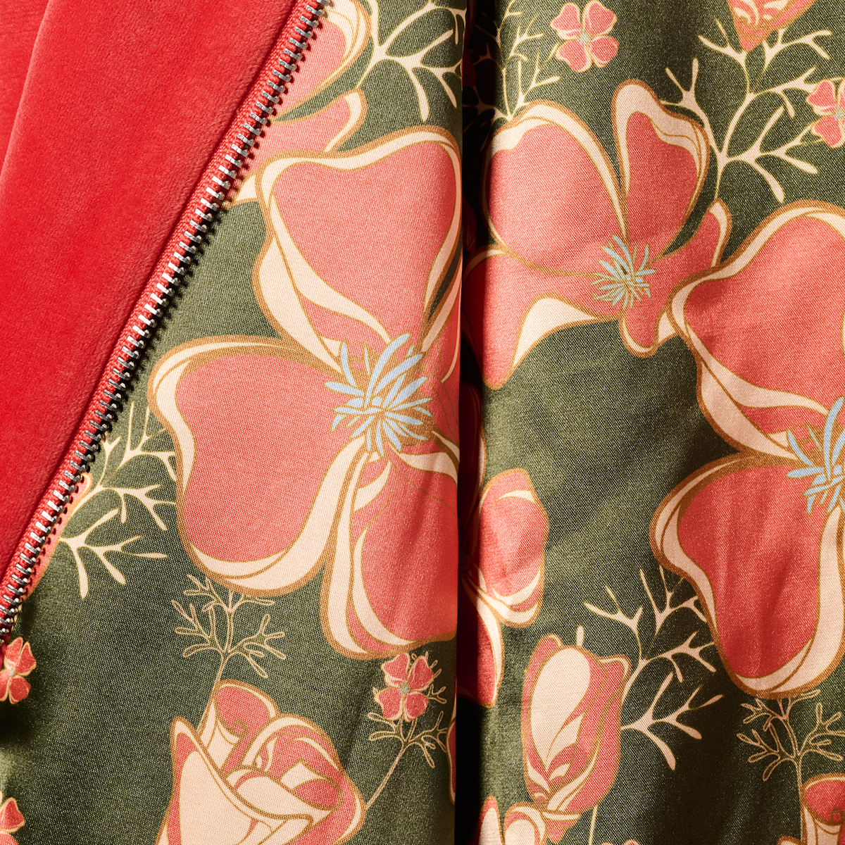 Close-up of the green and pink floral lining inside the HBarC x Gibson Dove red tour jacket.