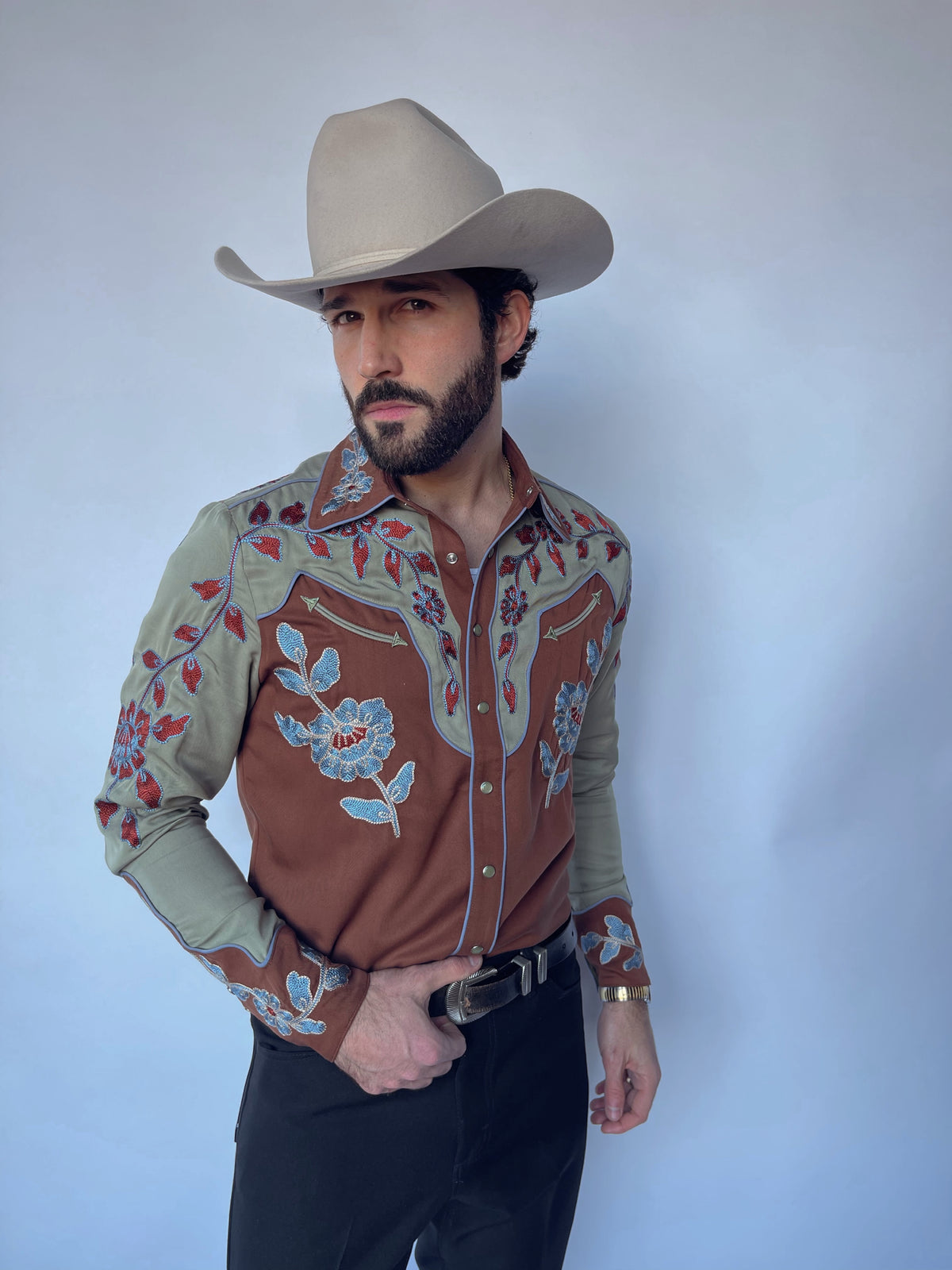 Front view of the H Bar C San Antonio men's brown and sage embroidered western shirt with black pants.