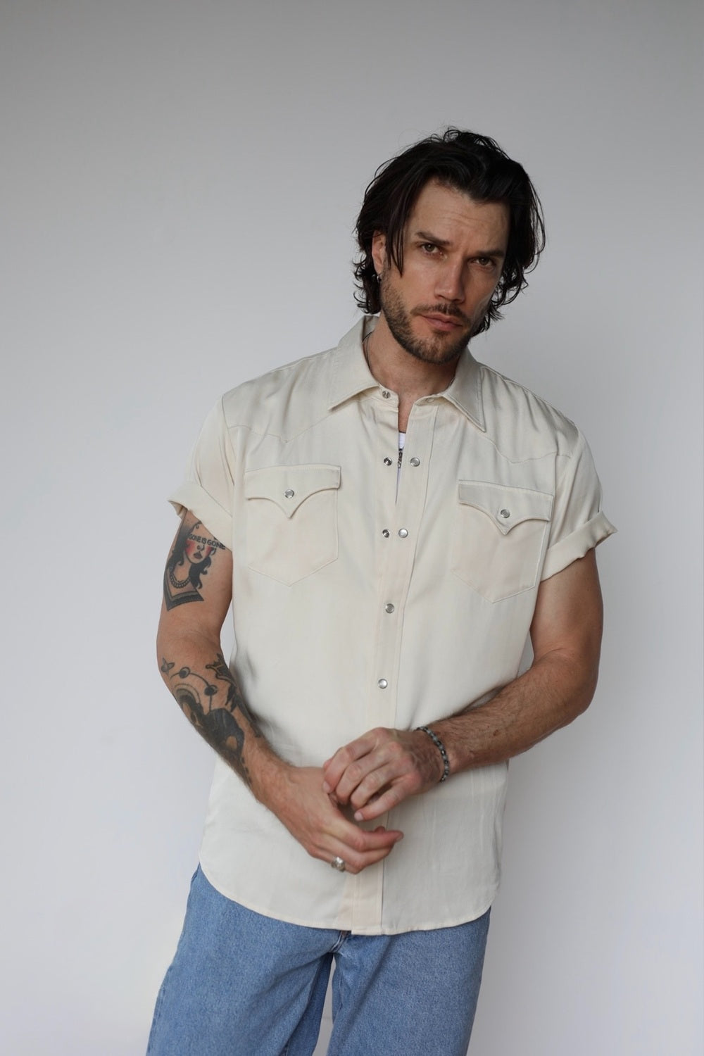 Front view of the H Bar C Newport off white short sleeve pearl snap shirt, the summer version of the Denver.
