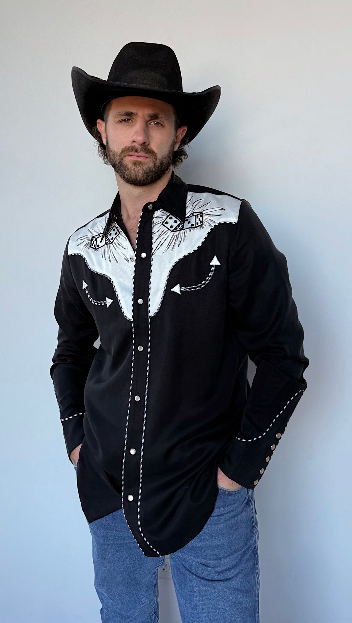 Front view of the H Bar C Jillette black and white embroidered western shirt with jeans.