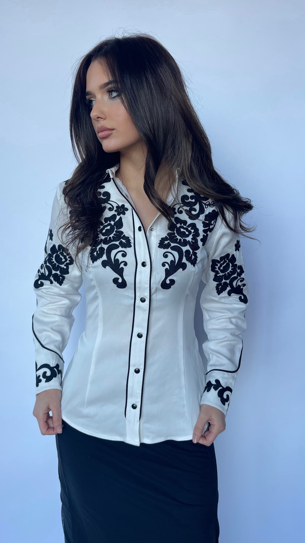 Front view of the H Bar C Fort Worth women's white embroidered western shirt with black piping.