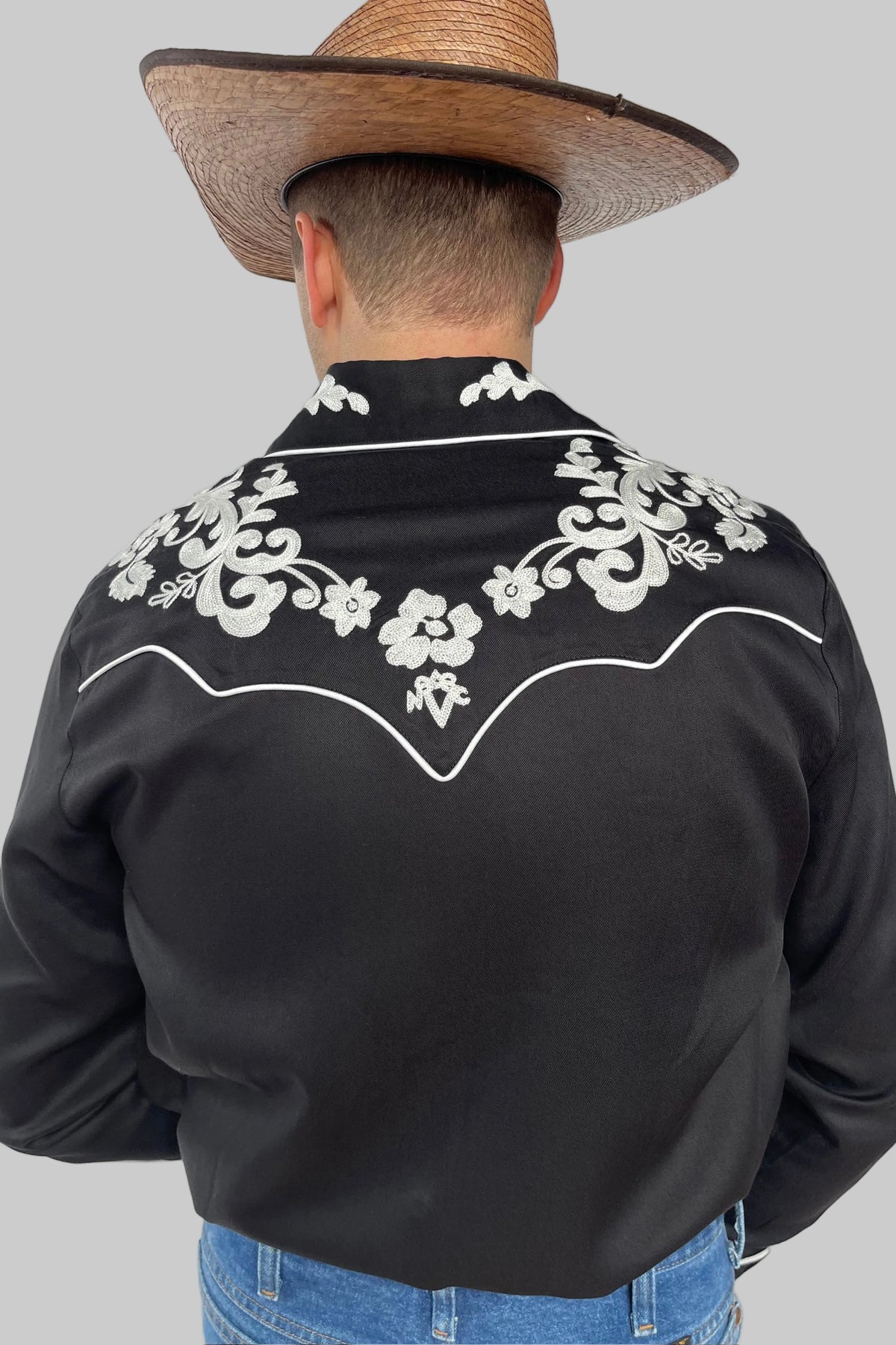 Back view of the H Bar C Durango black shirt with white floral chain stitch back yoke.