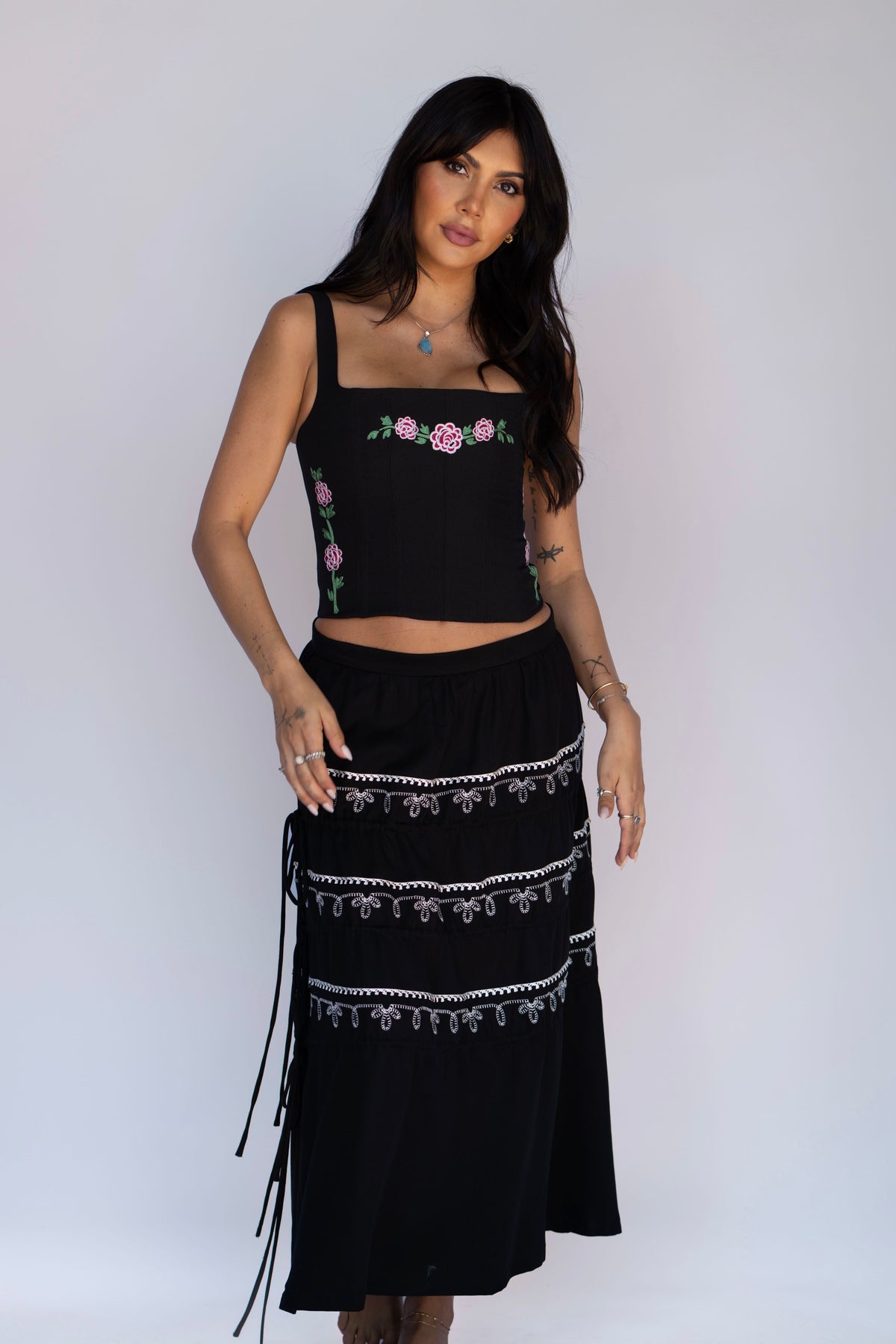 Front view of the H Bar C Coachella black embroidered skirt styled with the Canterbury rose corset.