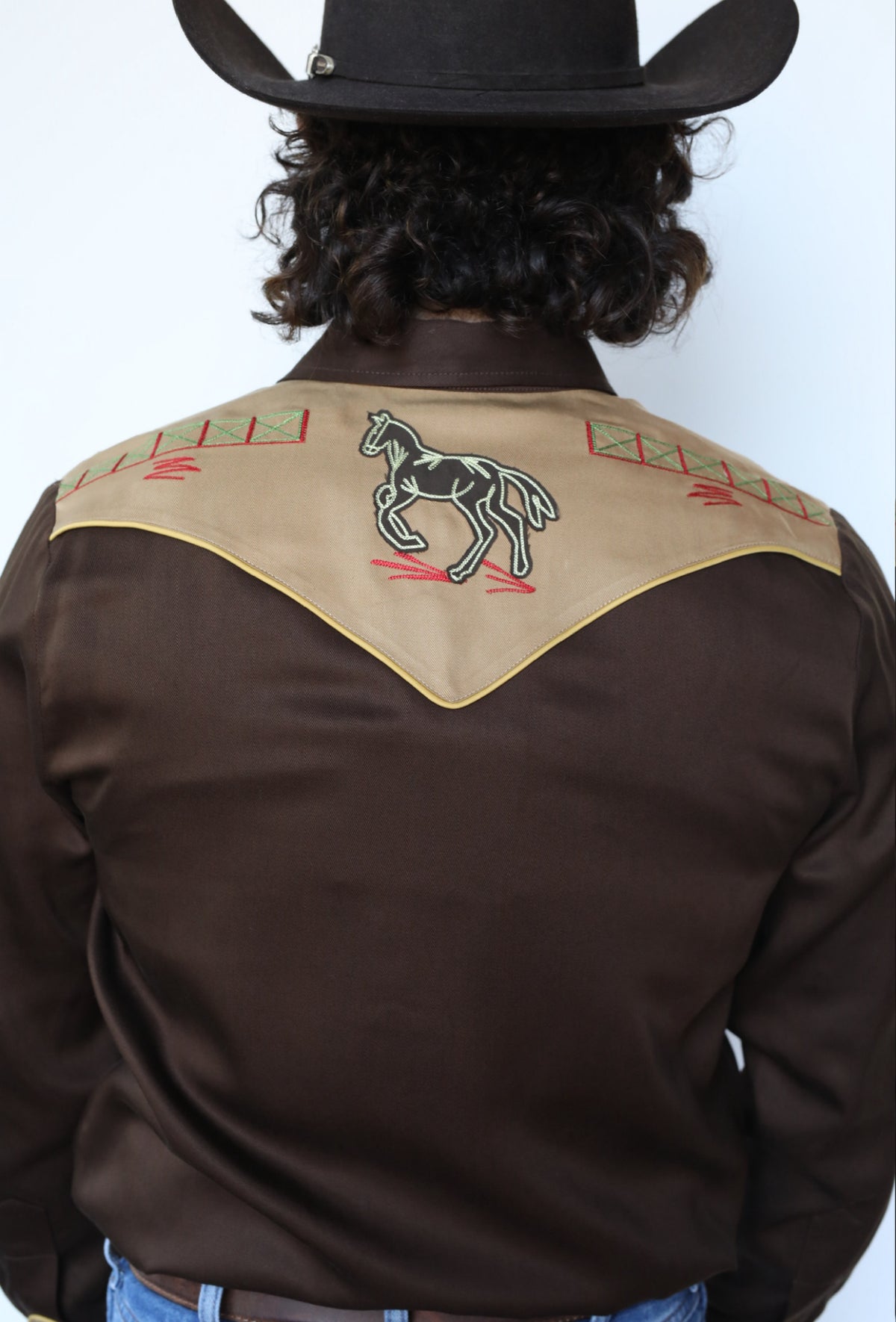 Back yoke detail of the embroidered bronc rider on the H Bar C Bozeman shirt.