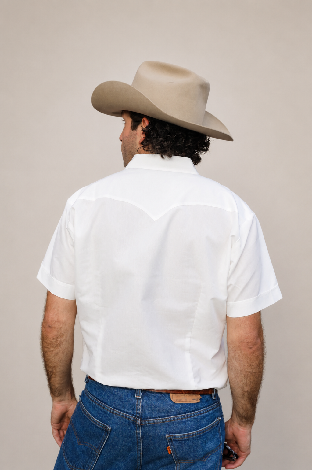 Back view of the H Bar C Newport Jacquard white shirt with a cowboy hat.