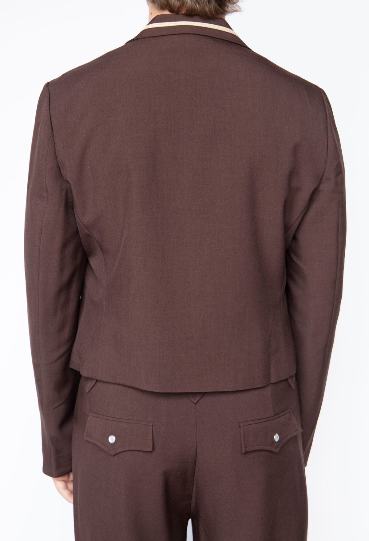 Rear view of the H Bar C Franklin chocolate pants with the matching chocolate Calamity jacket.