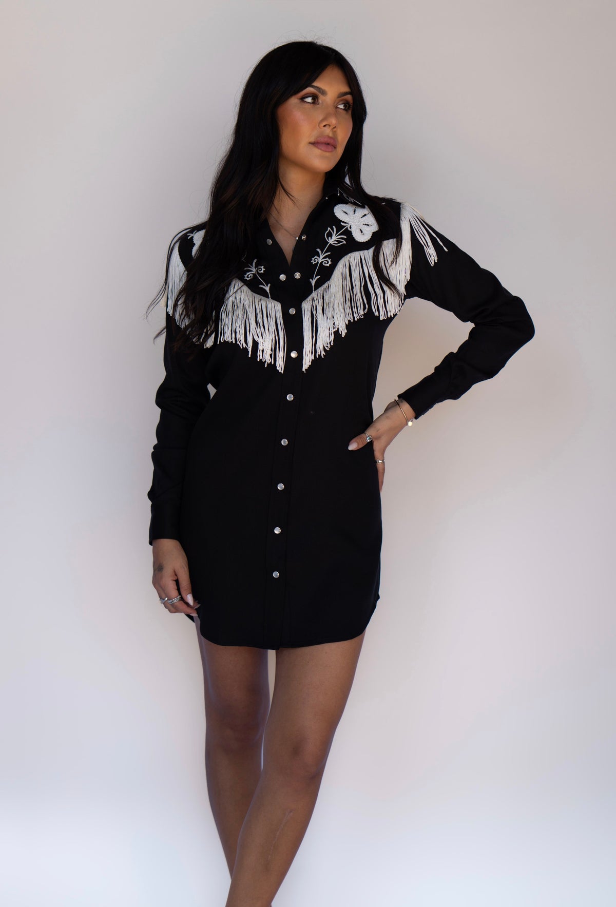 Full length view of the H Bar C Roswell women's black western dress with fringe.