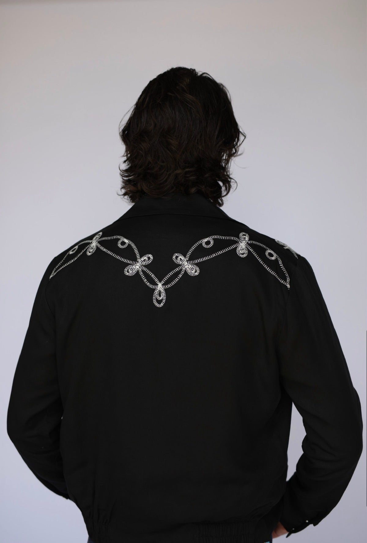 Back detail of the rope style soutache embroidery on the H Bar C El Patrón black Bolero jacket.