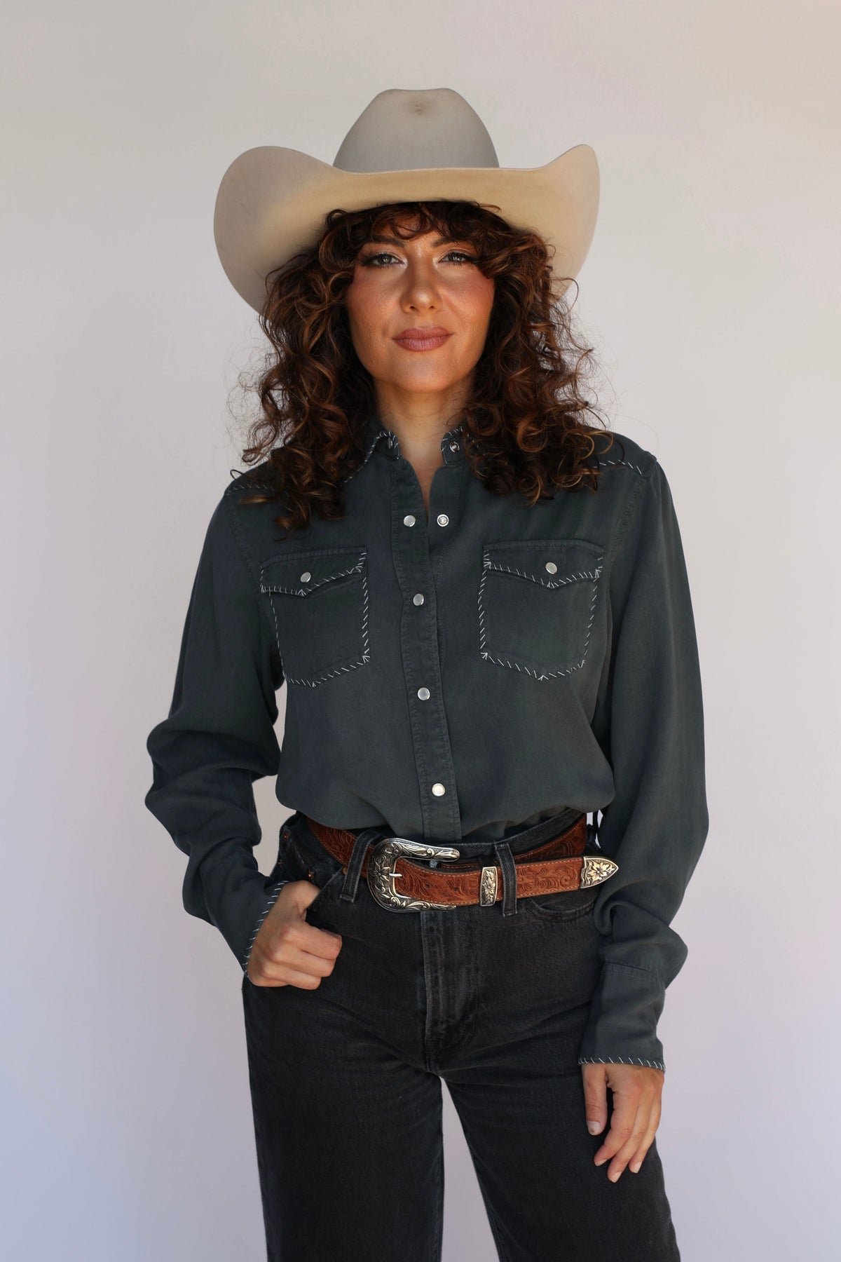 Front view of the H Bar C Brooklyn charcoal slate women's western shirt tucked into black jeans.