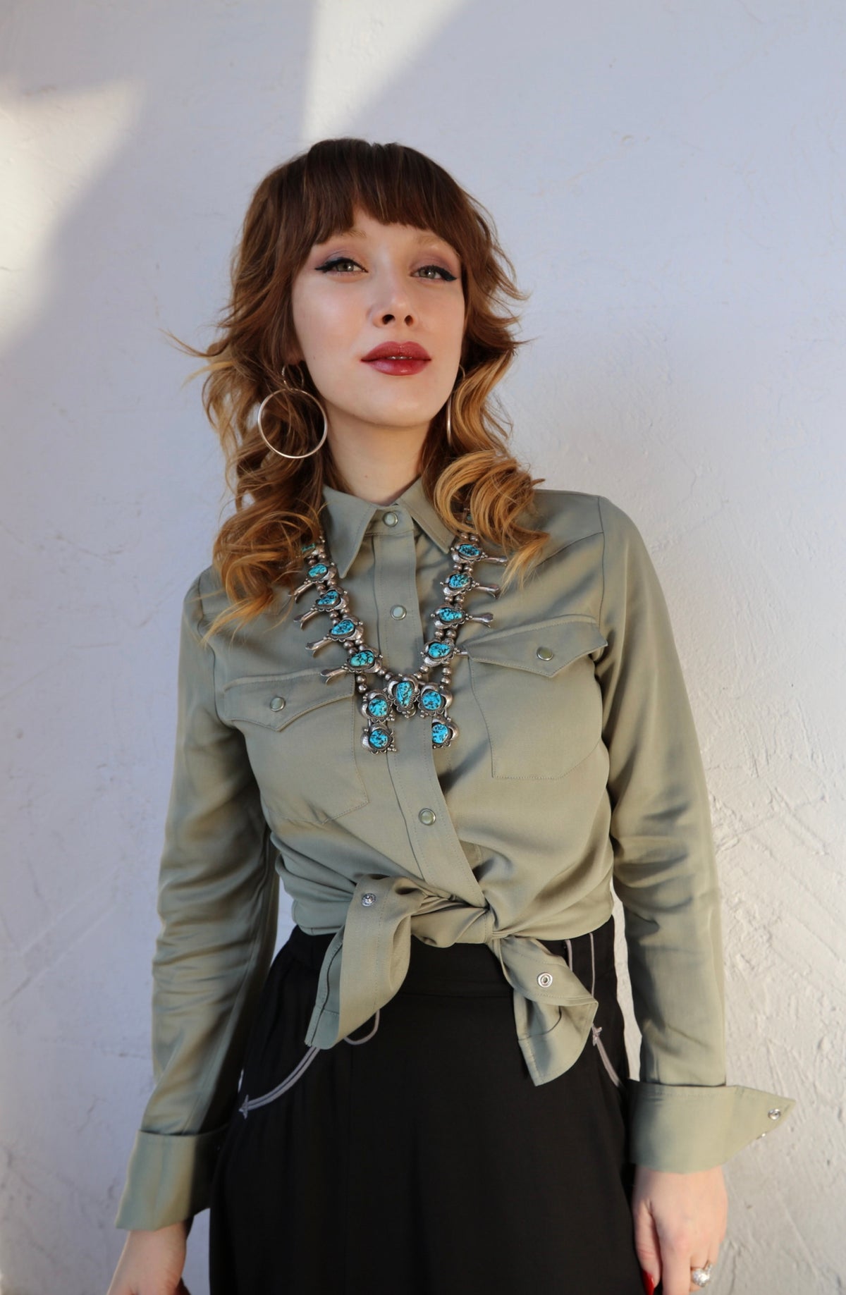H Bar C Denver women's green western shirt tied at the waist.