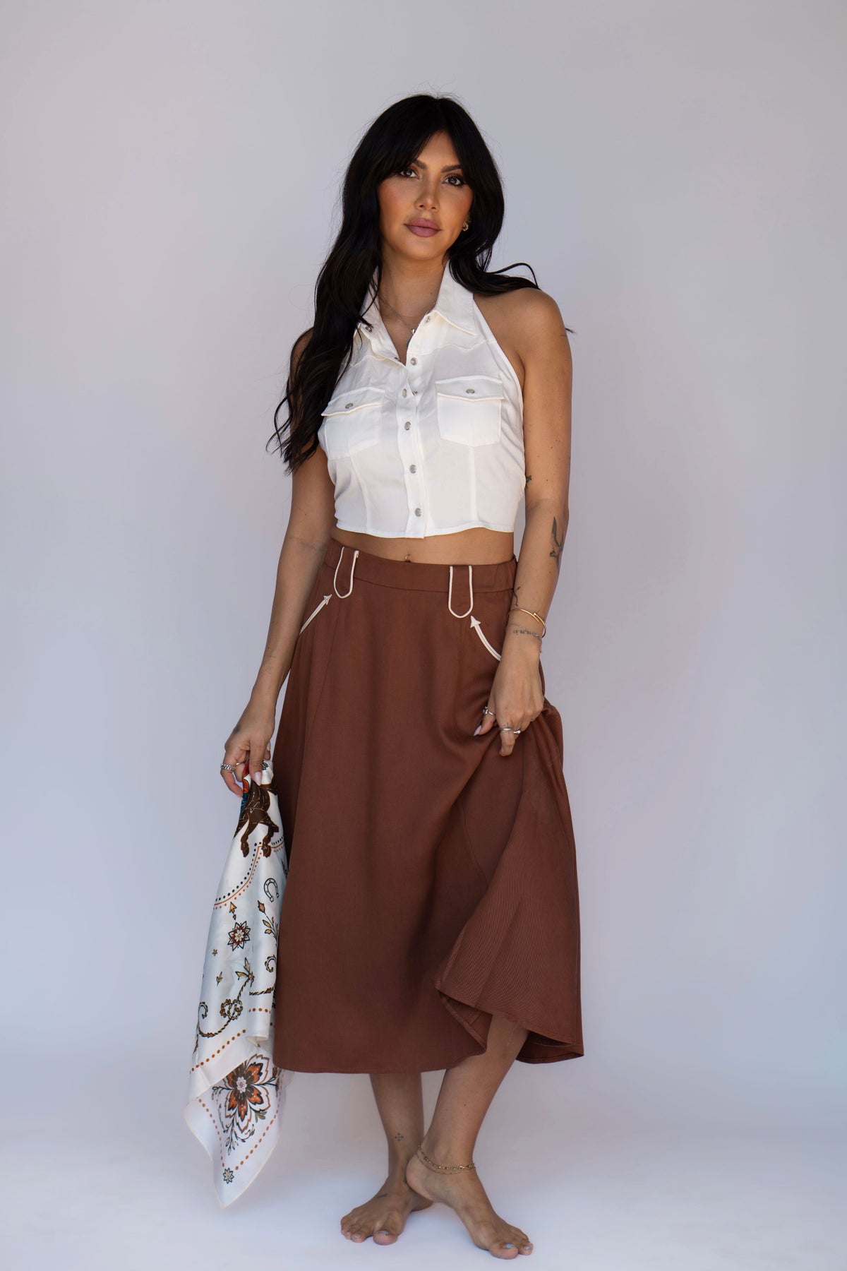 Full length view of the H Bar C Santa Fe chocolate swing skirt with a white western halter top.