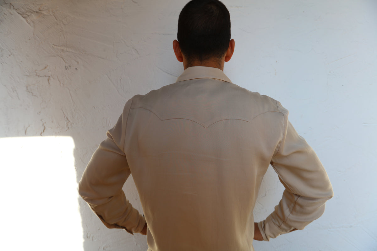 Back view of the H Bar C Kansas City beige shirt showing its signature triple back yoke.