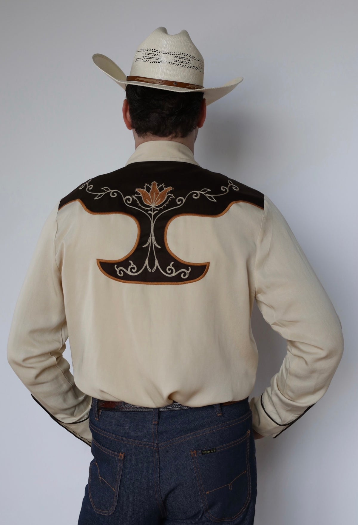 Back view of the H Bar C Santa Barbara cream western shirt with brown embroidered back yoke.