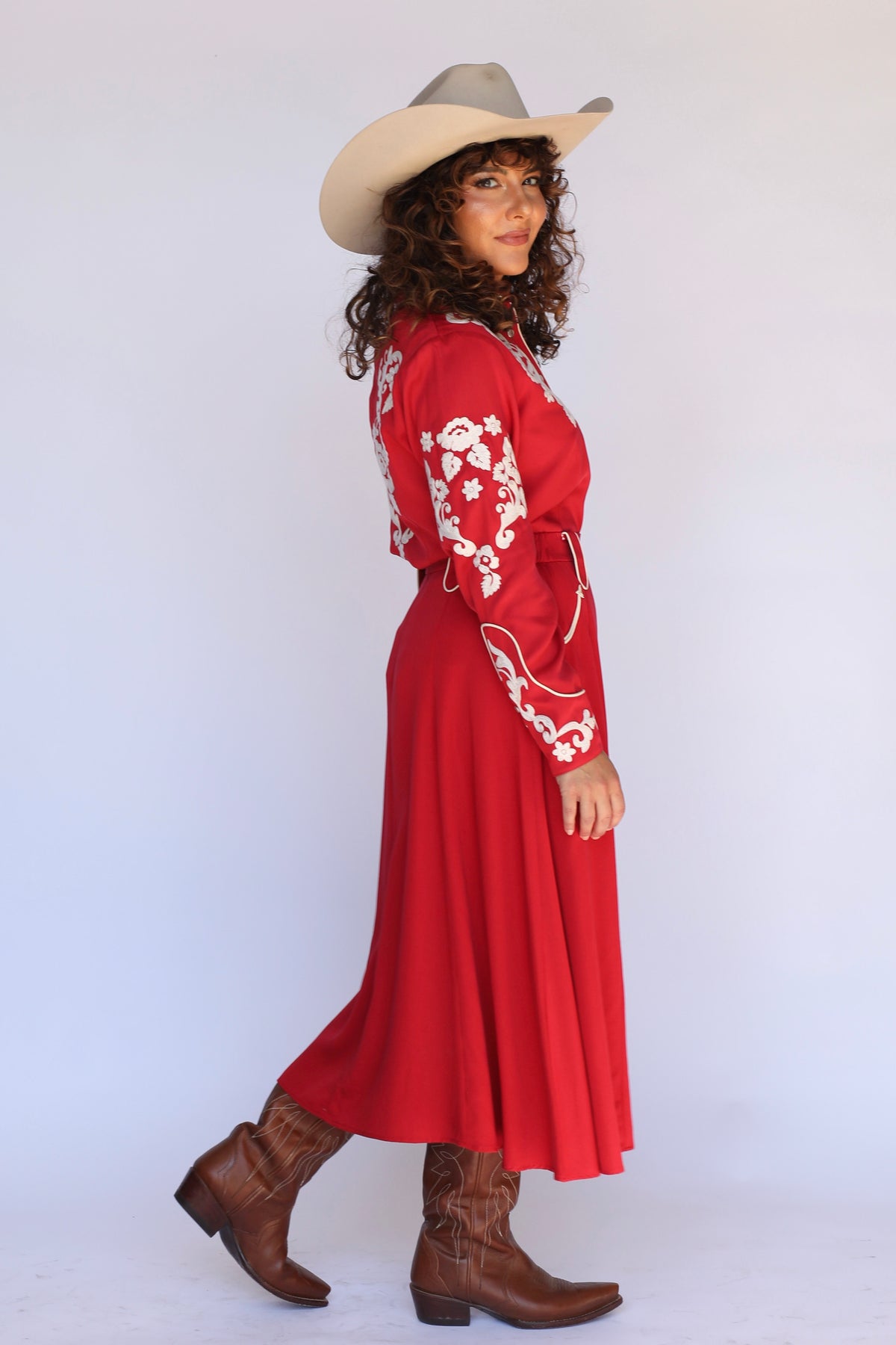 Woman walking in the H Bar C Santa Fe red western skirt showing its movement.