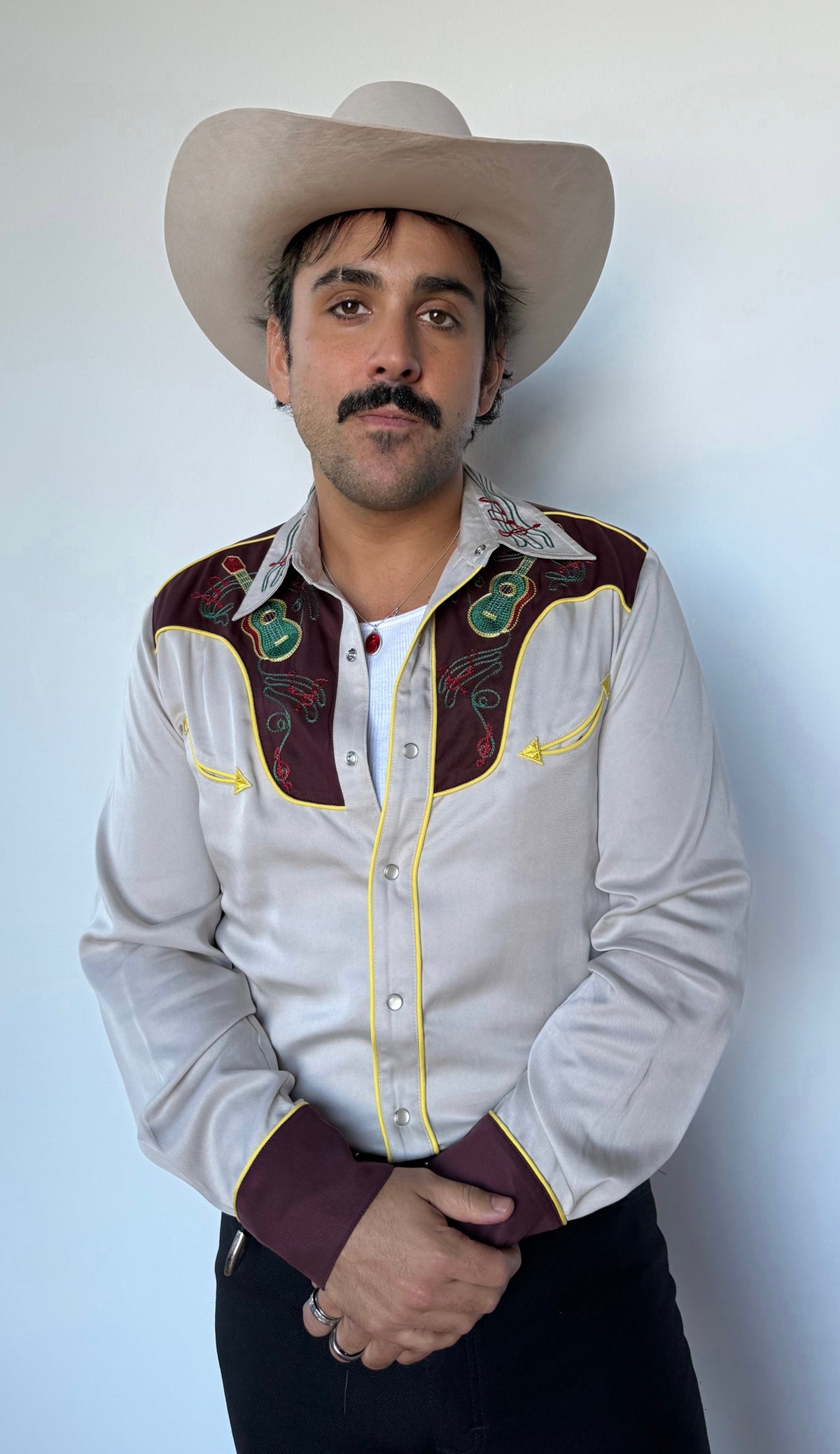 Man in a cream cowboy hat wearing the H Bar C Cowboy Bob vintage style western shirt.