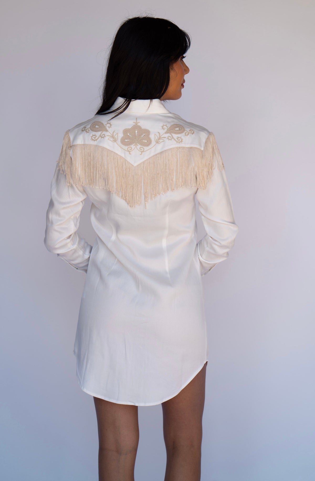 Back view of the H Bar C Roswell white western dress with beige fringe across the shoulders.
