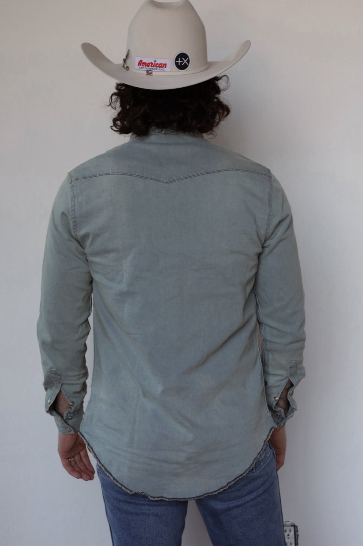 Back view of the H Bar C Resurgent sage western shirt with pointed back yoke.