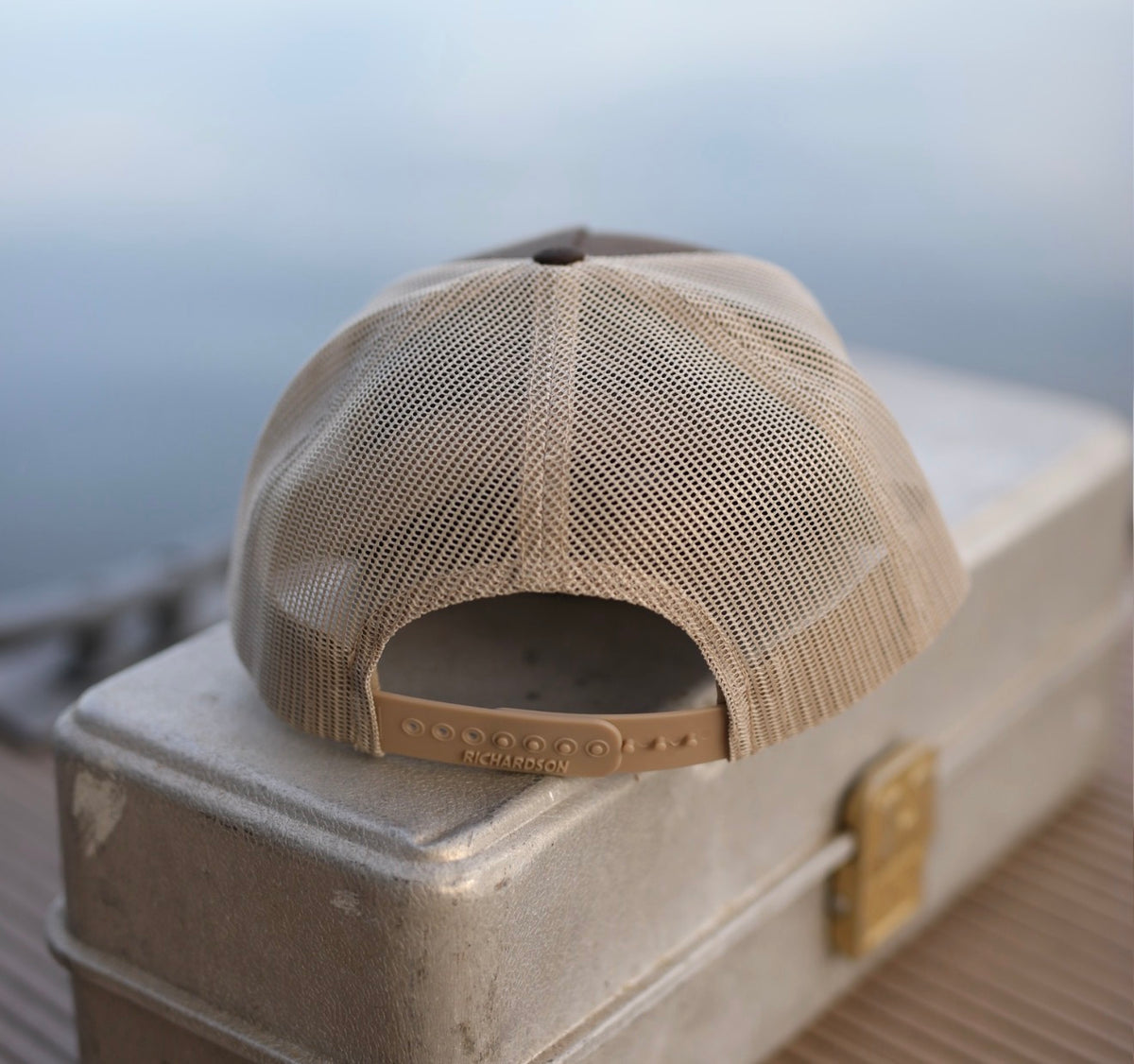 Back view of the H Bar C brown rope trucker hat showing the tan mesh panels.