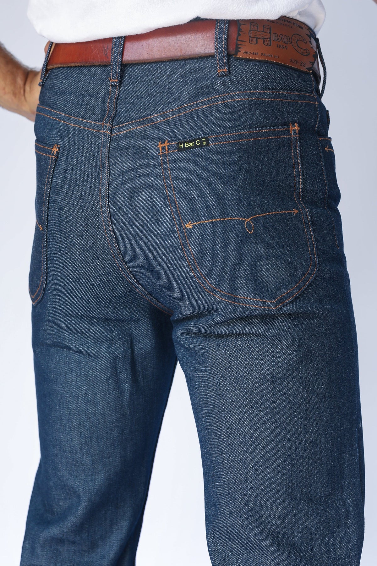 Back pocket close-up of the H Bar C Boot Cut Flare indigo jeans with contrast stitching.