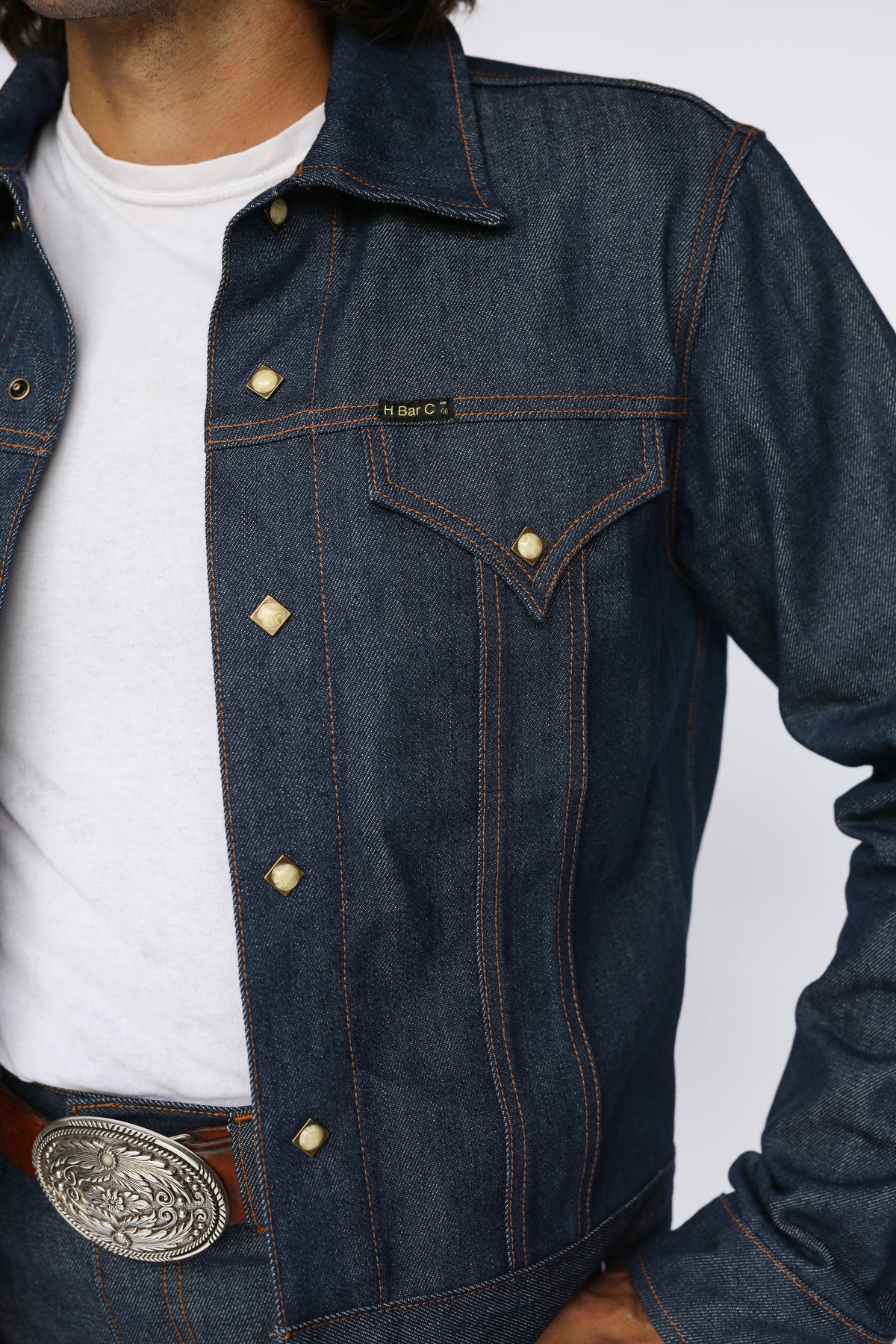 Close-up of the pleated front, pocket flap, and buttons on the H Bar C Salina indigo denim trucker jacket.