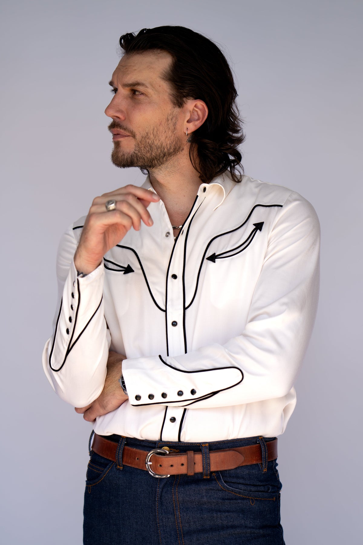 Side view of the H Bar C San Fernando men's shirt in white with black piping and arrow details, a vintage H Bar C classic.