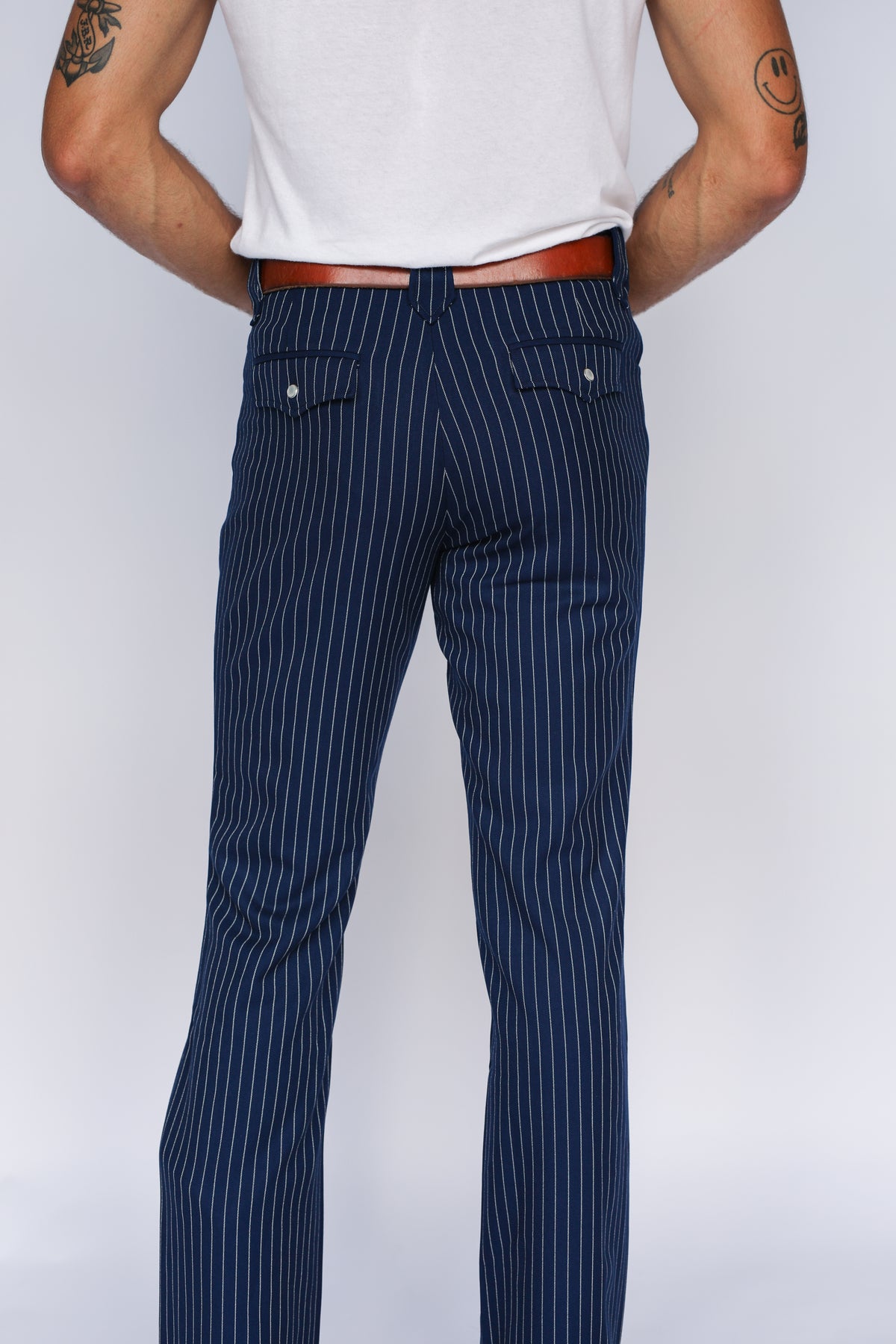 Back view of the H Bar C Bakersfield navy pinstripe western pants from the waist down.