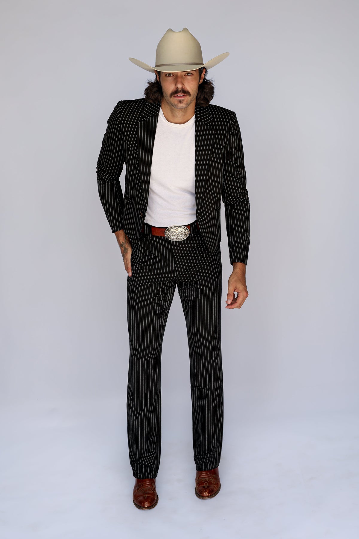 Full length view of the H Bar C Bakersfield black pin stripe suit with boots and cowboy hat.