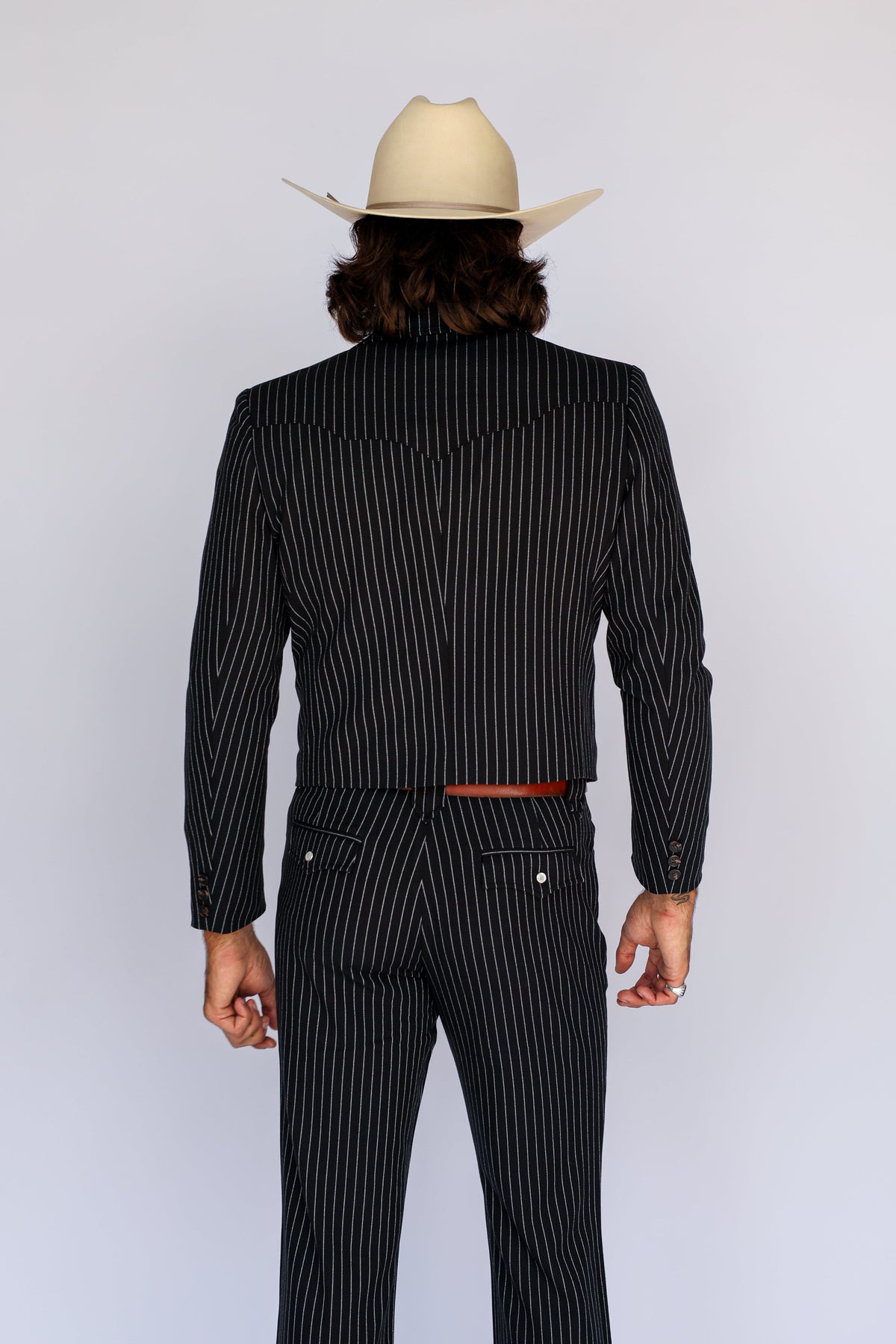 Back view of the H Bar C Bakersfield black pinstripe jacket and matching western pants.