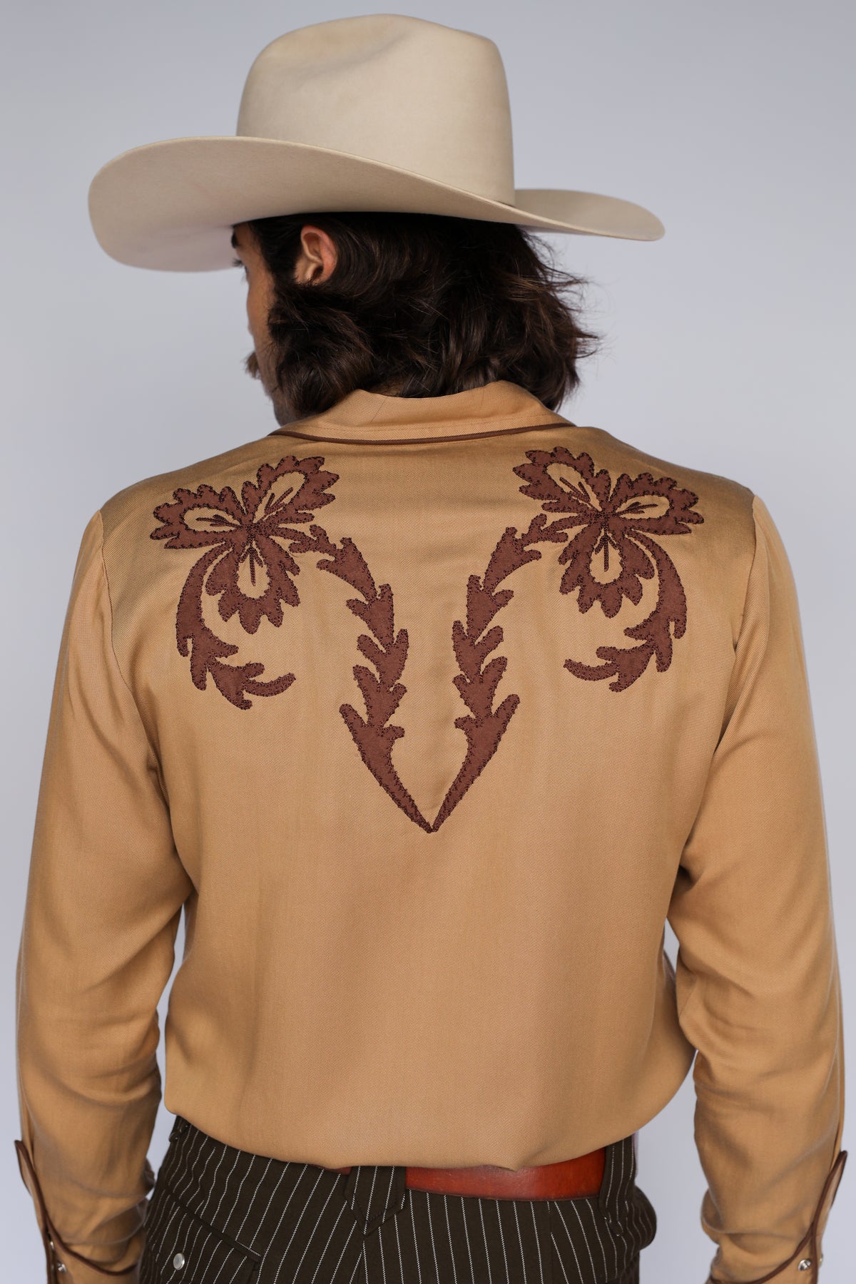 Back view of the H Bar C Terlingua tan shirt with brown embroidered back yoke.