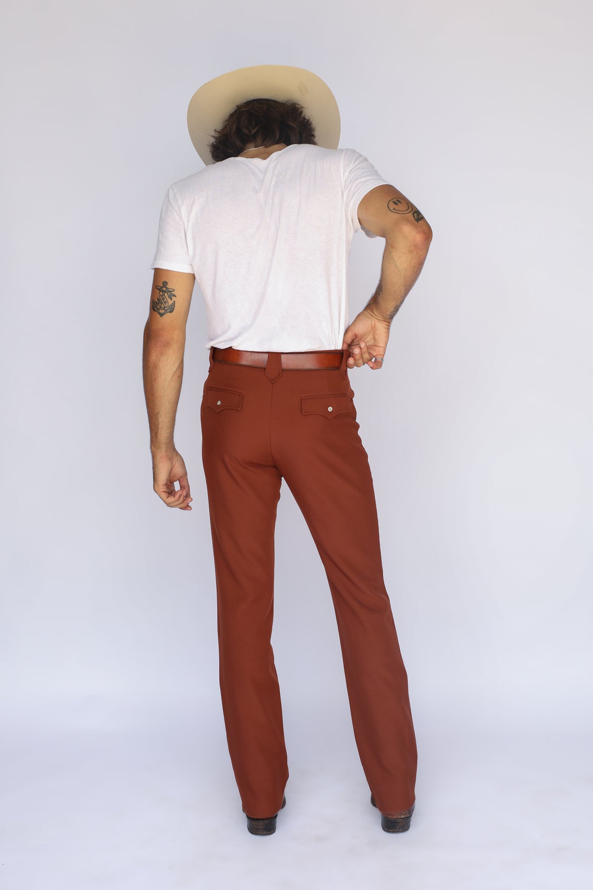 Back view of the H Bar C Franklin unisex brown pants with a white tee.
