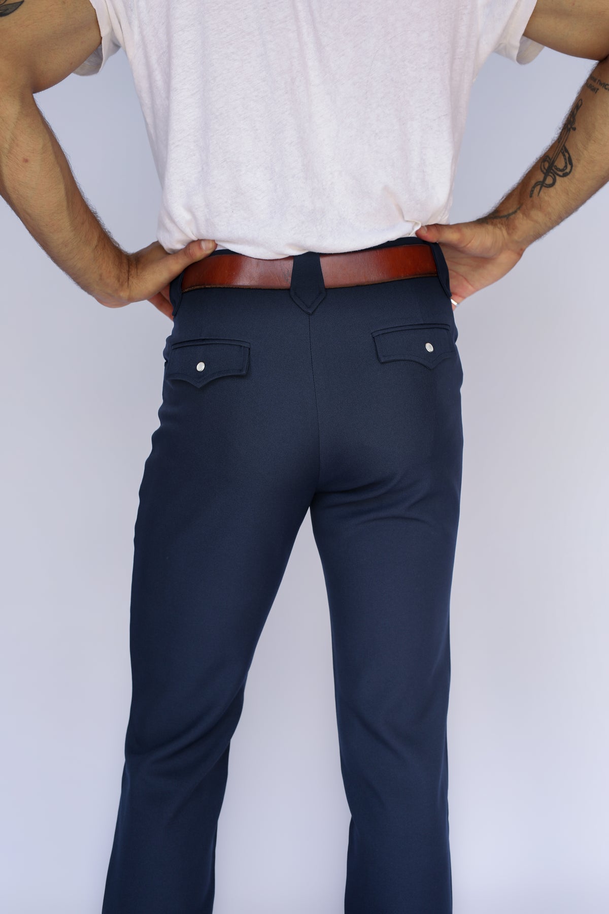 Back close-up of the H Bar C Franklin navy western pants showing the flap back pockets.