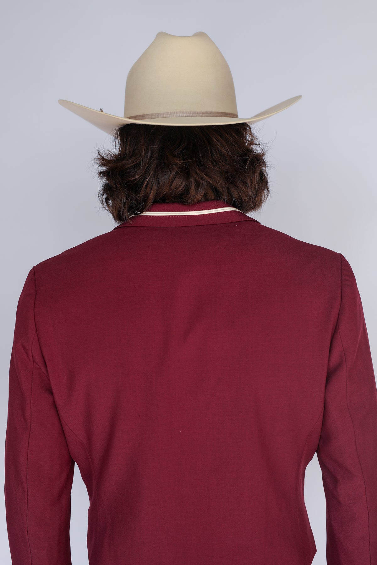Back view of the H Bar C Calamity men's maroon western jacket with cream collar trim.