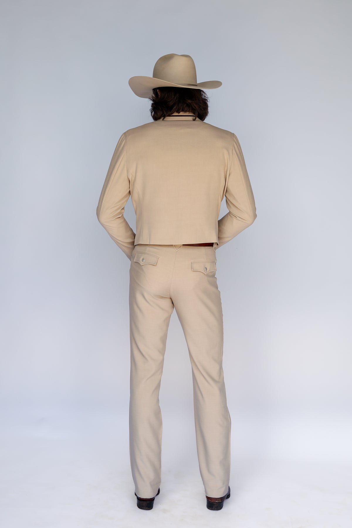 Back view of the H Bar C Calamity tan jacket and pants.