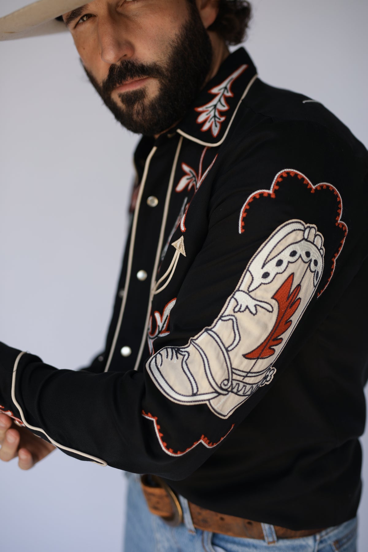 Close-up of the embroidered sleeve and front of the H Bar C Calabasas black western shirt.