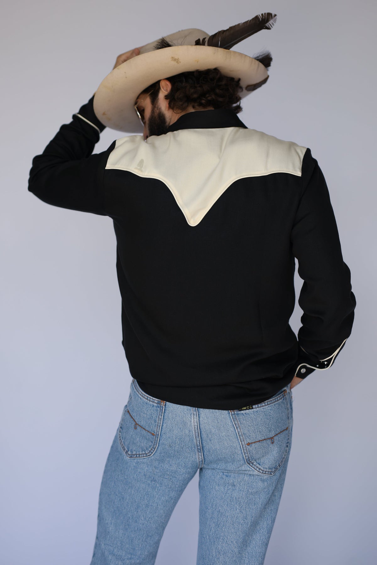 Back view of the H Bar C San Juan black western shirt with contrasting cream V back yoke.