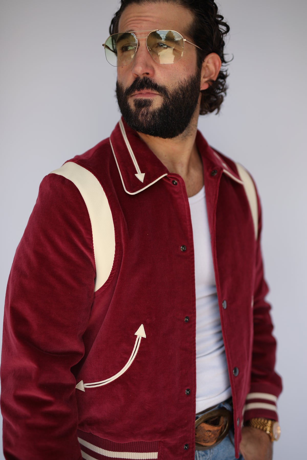 Man in aviator glasses wearing the H Bar C Silver Lake maroon corduroy unisex jacket.