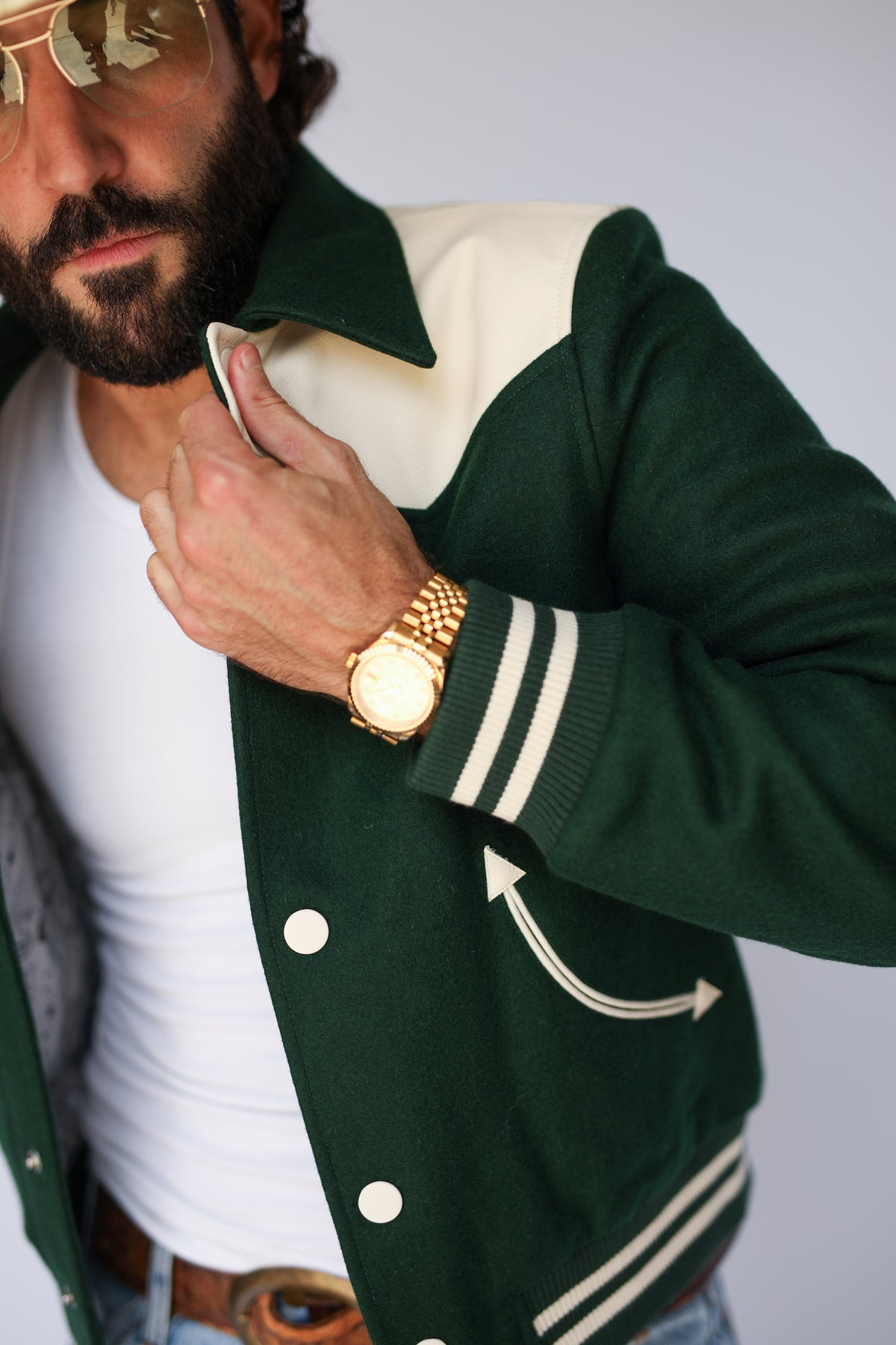 Close-up of The Vail green jacket by H Bar C with cream yoke and arrow pocket.