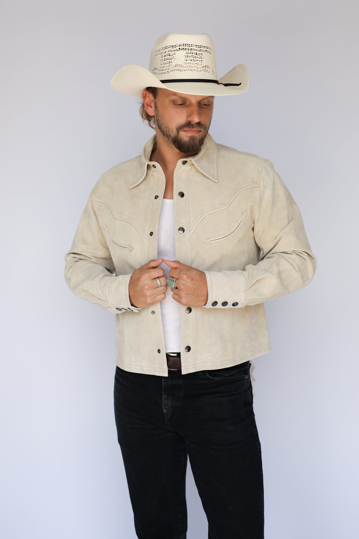 Man snapping the H Bar C Austin stone suede western jacket.