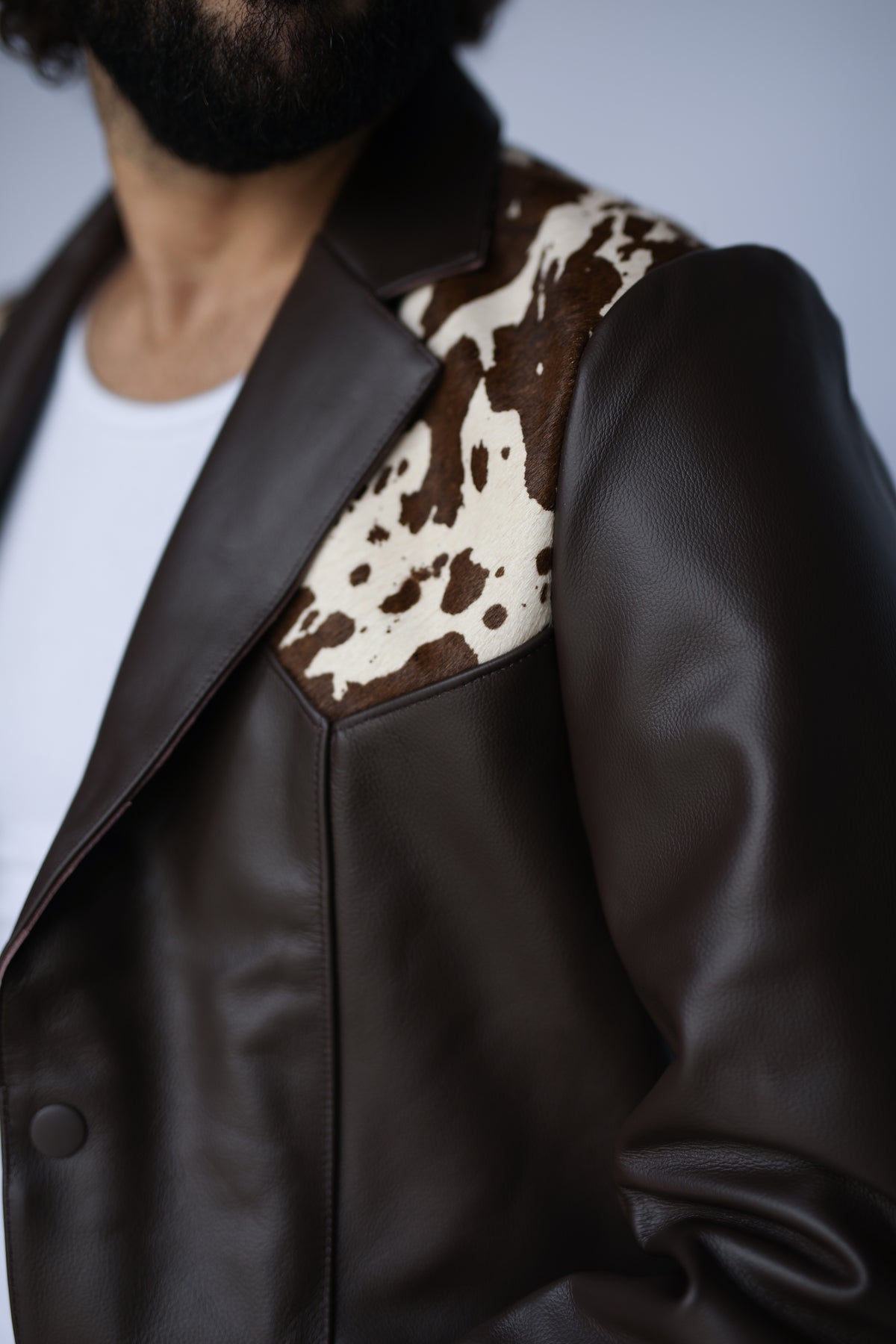 Close-up of the lapel and cowhide yoke on the H Bar C Cody leather western jacket.