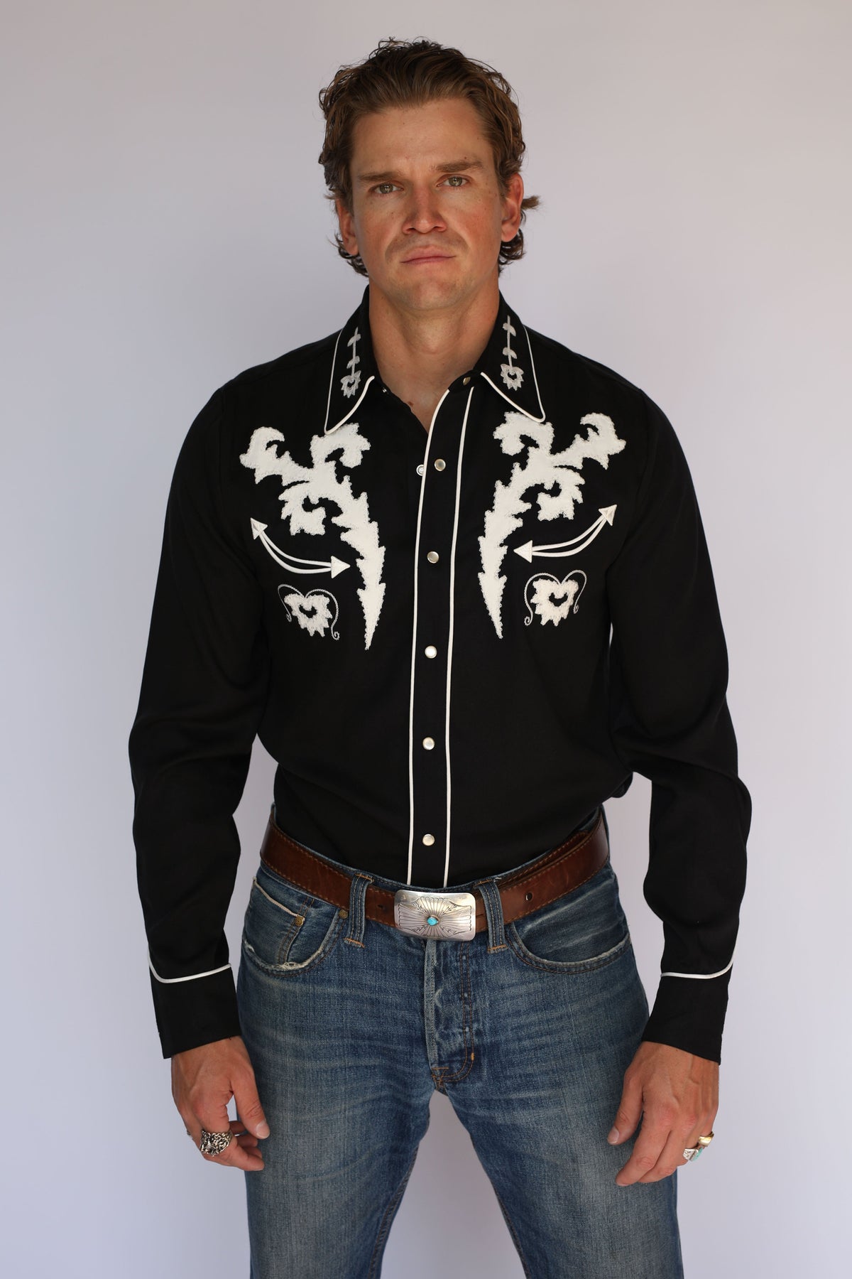 Model in the H Bar C Dali western shirt, a black embroidered statement shirt inspired by the surrealist artist.