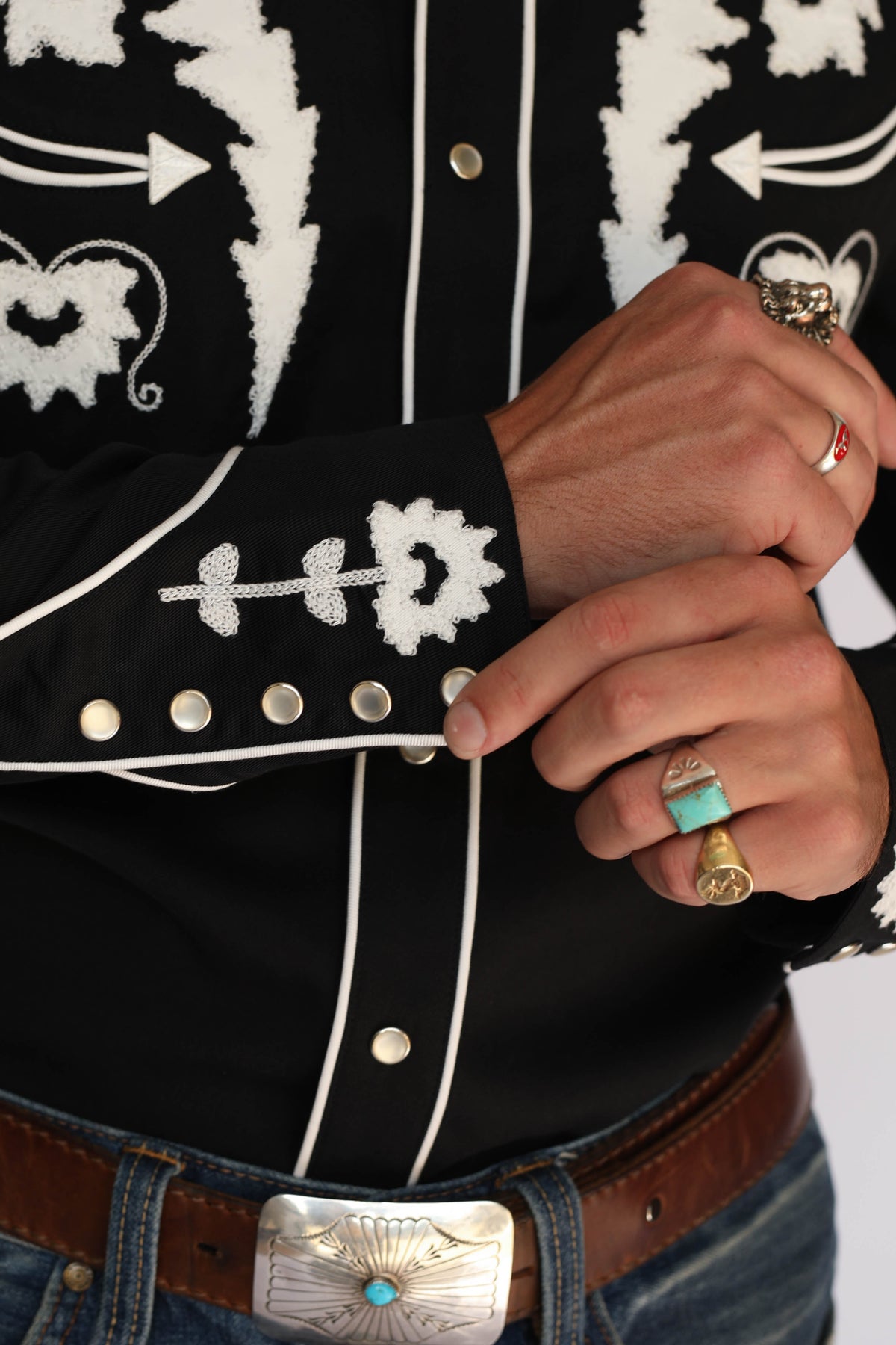 Cuff detail of the H Bar C Dali western shirt with white embroidery and multi-snap rodeo cuff.