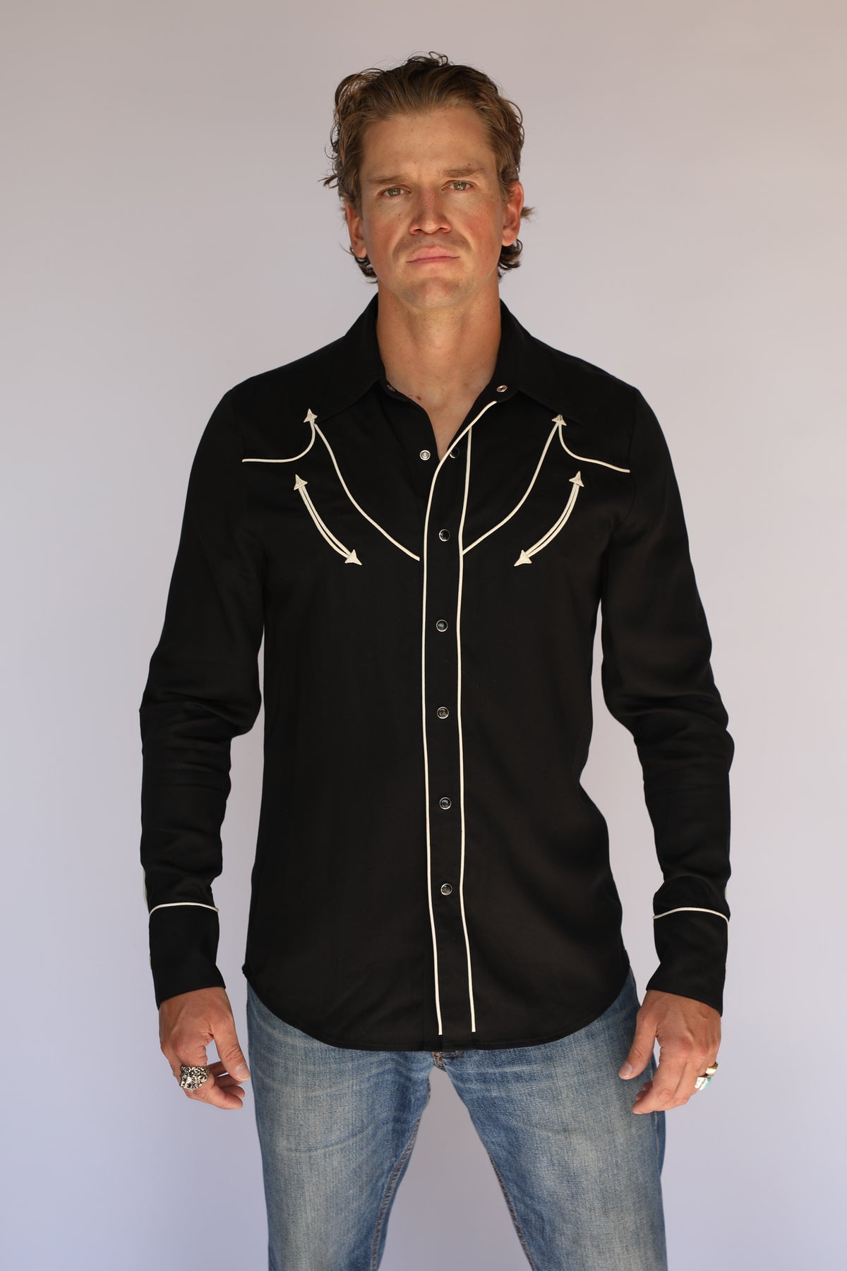 Full front view of the H Bar C Reno black shirt with off-white piped yokes and placket, vintage western wear worn with jeans.