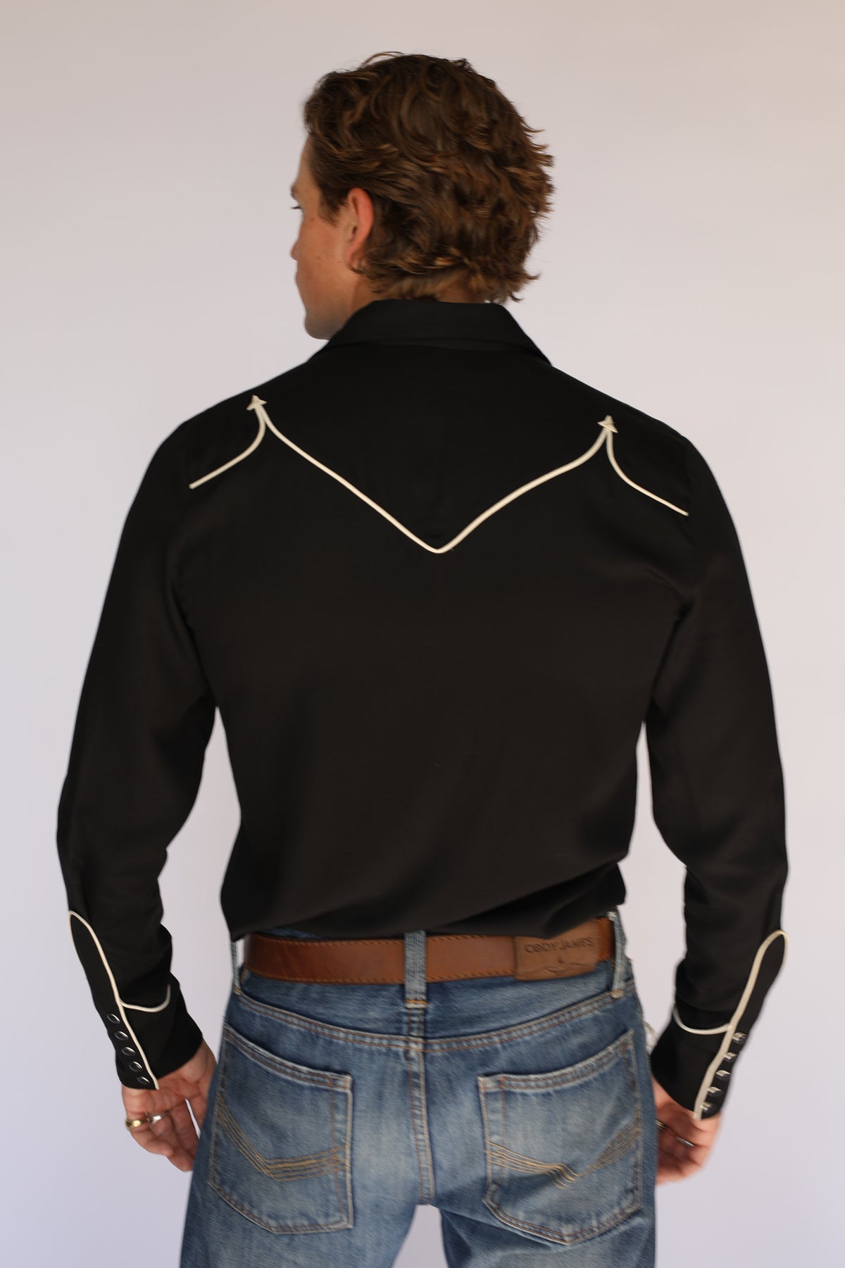 Back view of the H Bar C Reno black western shirt with off-white piped back yoke, vintage inspired western wear.