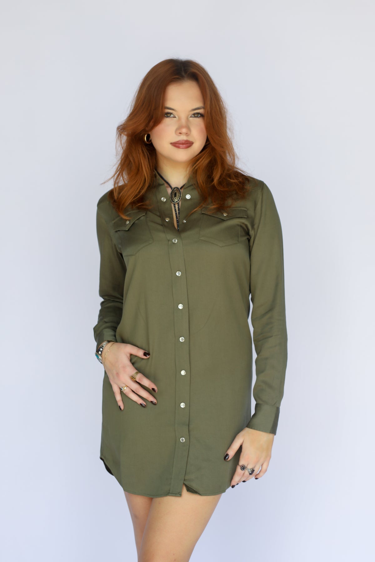 Woman posing in the H Bar C Savannah green western shirt dress.