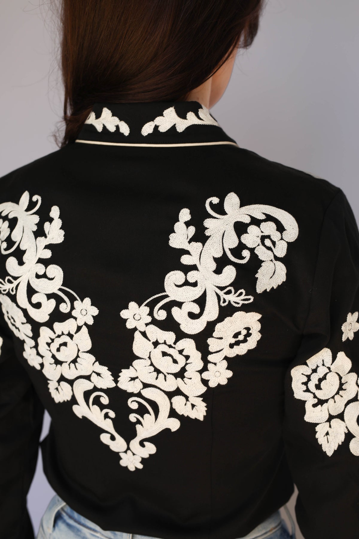 Close-up of the back embroidery on the H Bar C Fort Worth black western shirt, vintage western wear detail.